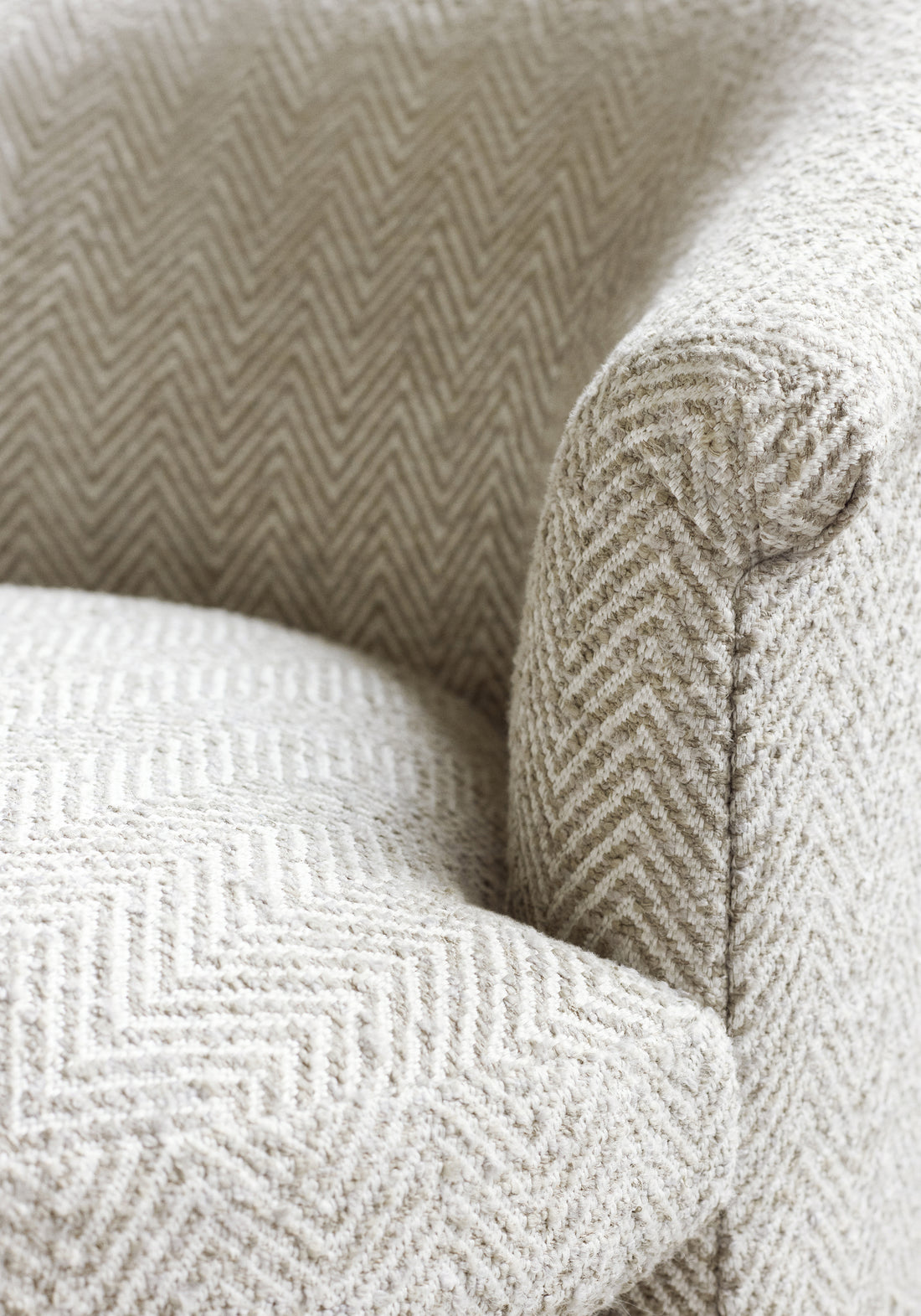 Frontal detailed view of Ashby Chair in Monviso woven fabric in stone color - pattern number W77125 - by Thibaut in the Veneto collection