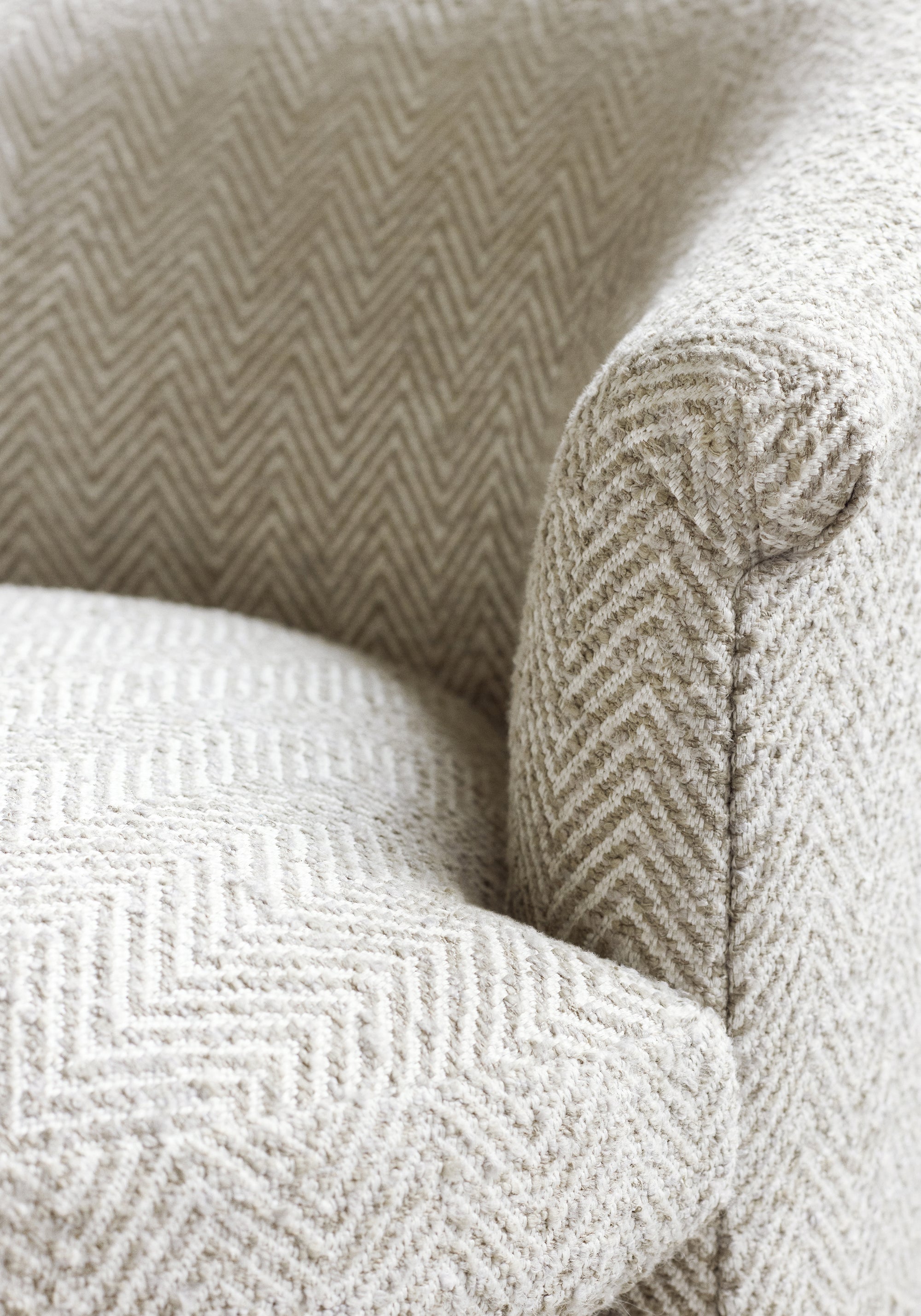 Frontal detailed view of Ashby Chair in Monviso woven fabric in stone color - pattern number W77125 - by Thibaut in the Veneto collection