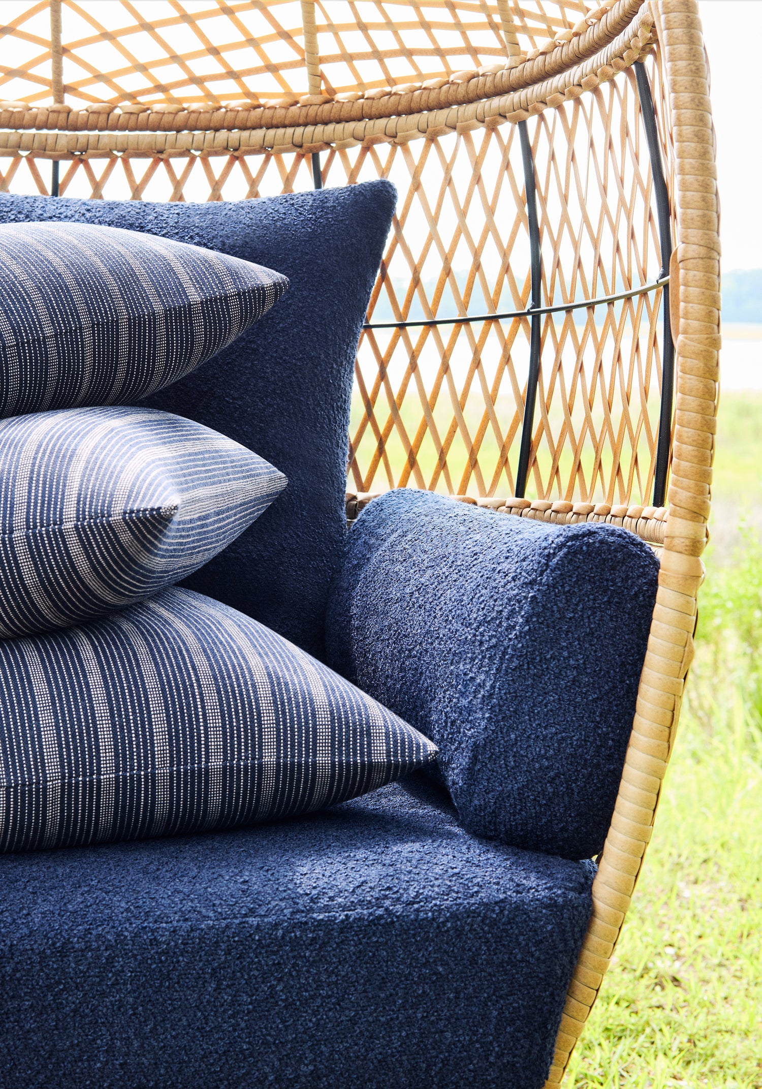 Detail of Chair cushion in Capra woven fabric in navy color - pattern number W8591 - by Thibaut fabrics
