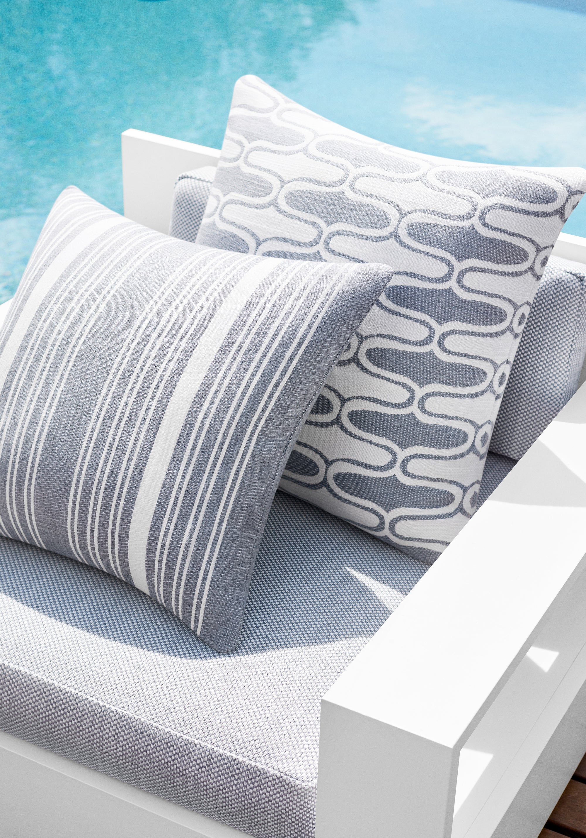 Detail of chair cushion in Ravenna woven fabric in horizon color - pattern number W8617 - by Thibaut fabrics