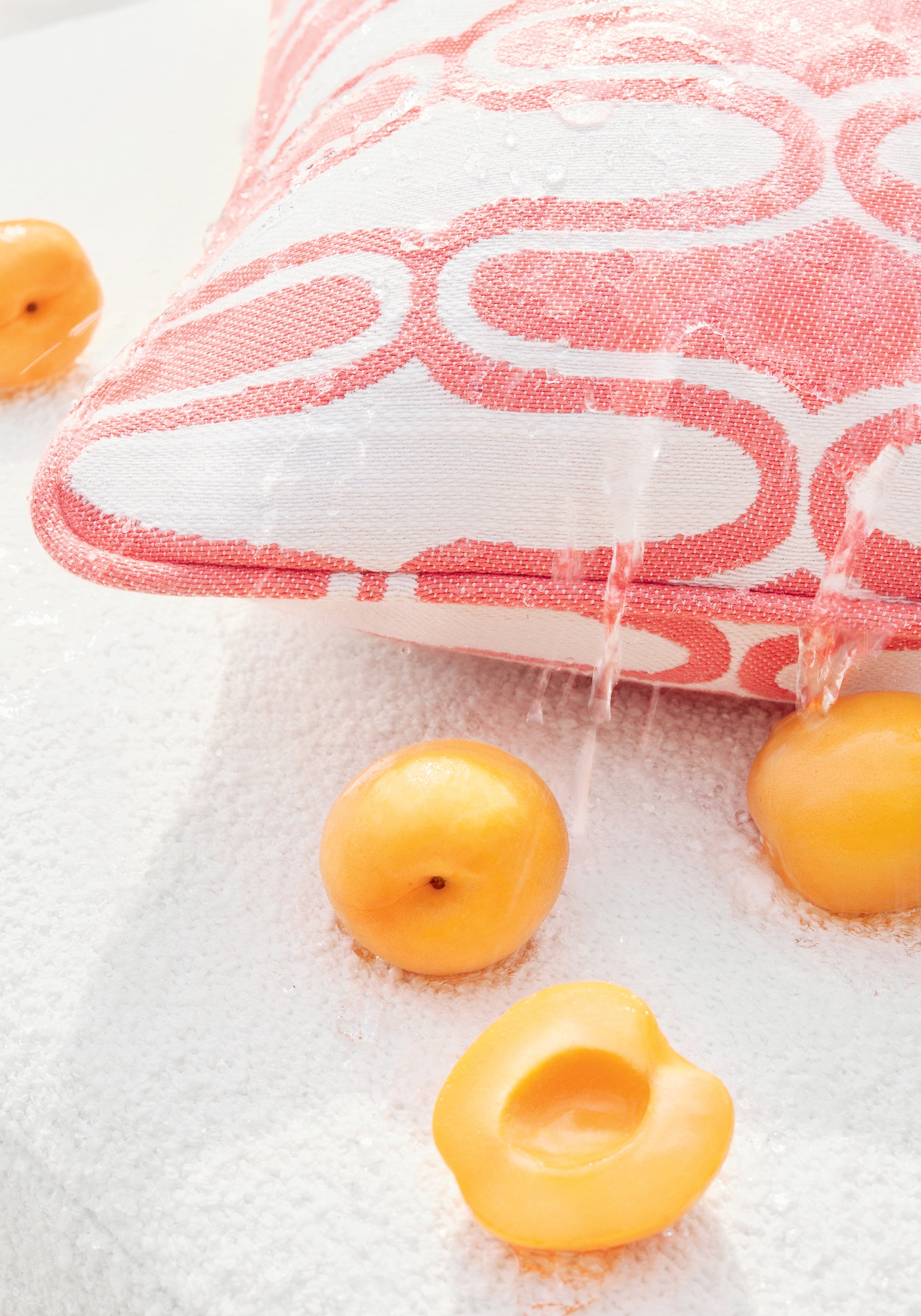 Water repelling off pillow in Saraband fabric in coral color - pattern number W8532 - by Thibaut in the Villa collection