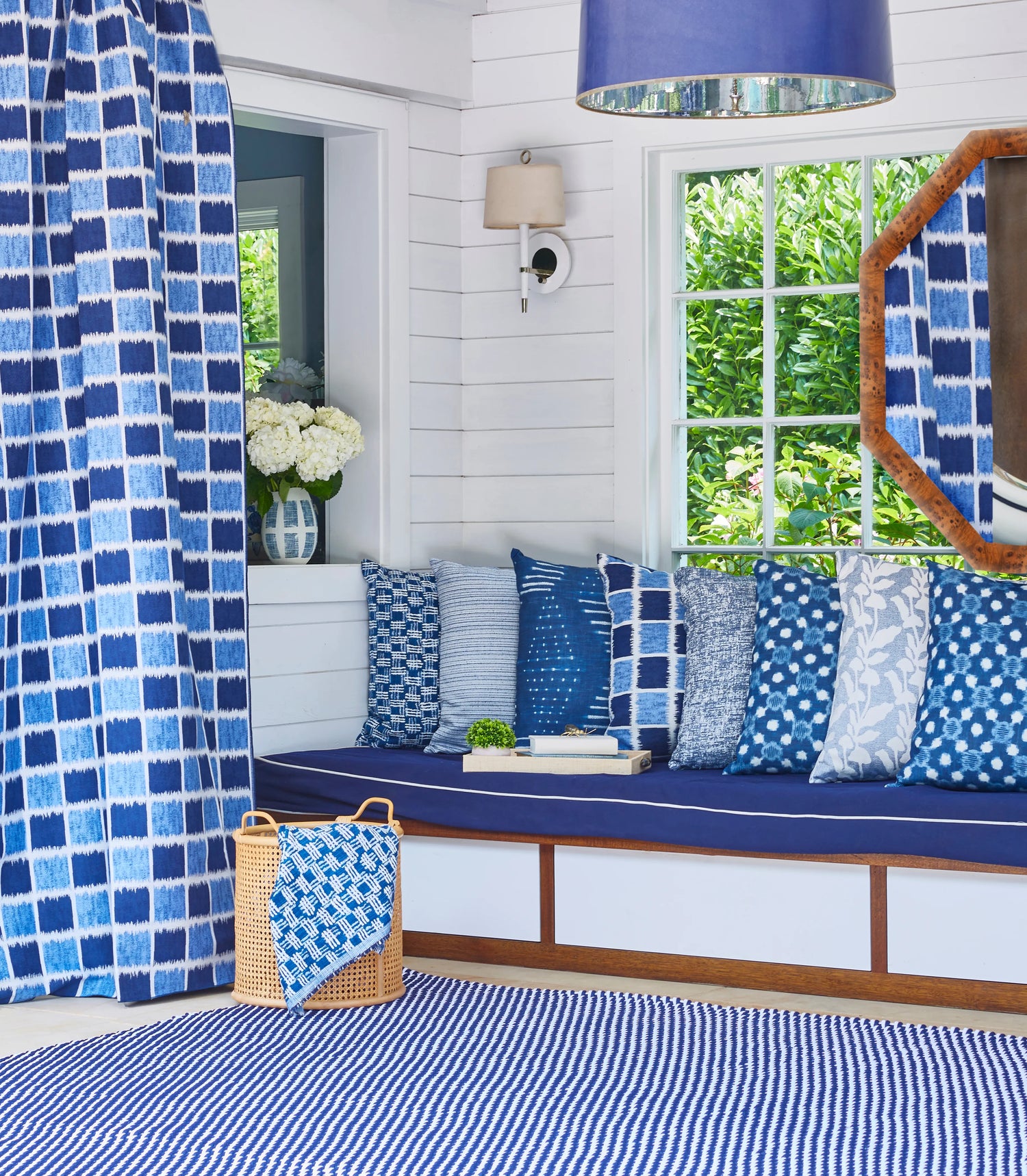 Outdoor curtain and pillow made with Ikat Squares fabric in marine color - pattern 36936.5.0 - by Kravet Couture in the Riviera collection