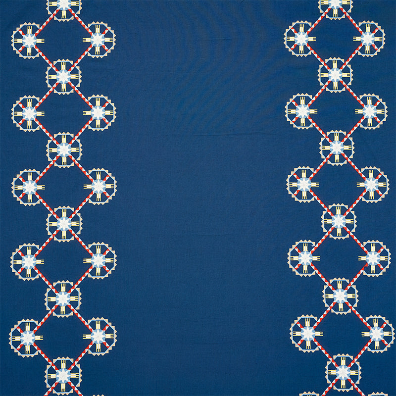 Chamizal Embroidery fabric in blue and red color - pattern number 77601 - by Schumacher in the True West collection