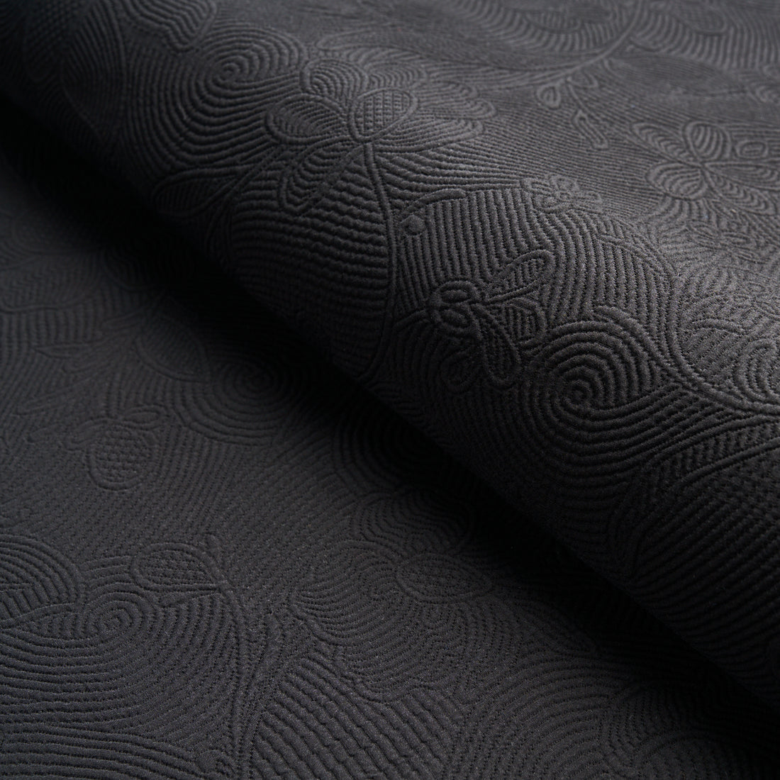 Quilted Scroll Matelasse fabric in pitch black color - pattern number 81591 - by Schumacher in the Williamsburg collection