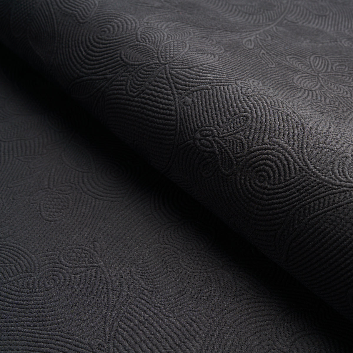 Quilted Scroll Matelasse fabric in pitch black color - pattern number 81591 - by Schumacher in the Williamsburg collection