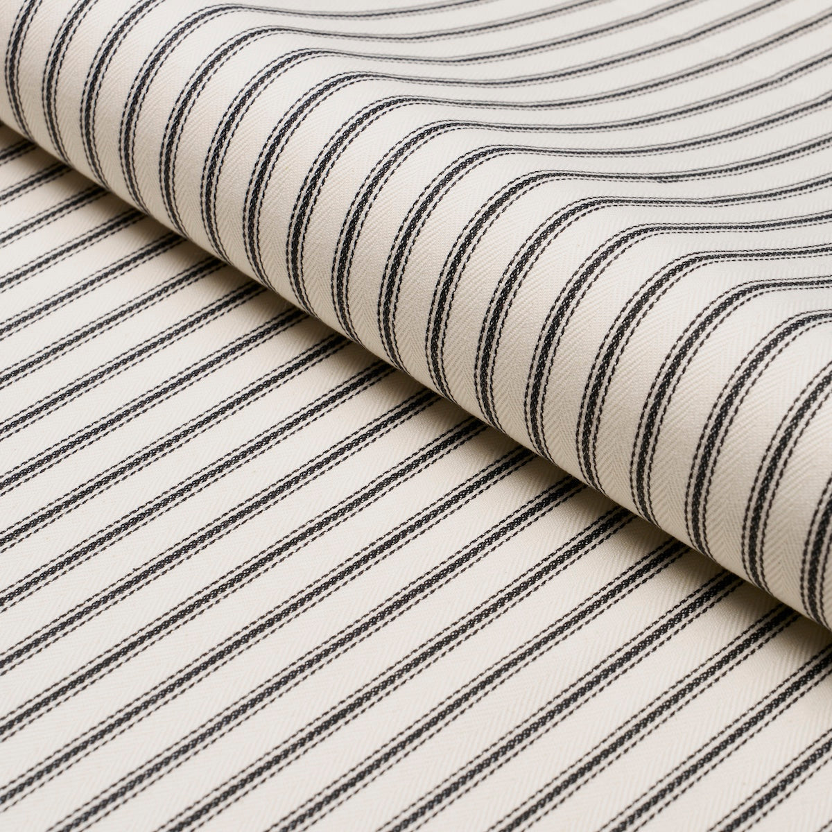 Griffin Ticking Stripe fabric in black and white color - pattern number 84860 - by Schumacher in the Perennial Favorites collection