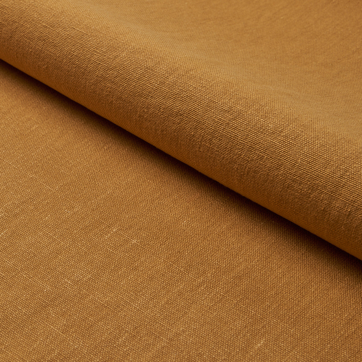 Jumi Stonewashed Linen fabric in ochre color - pattern number 84905 - by Schumacher in the Perfect Basics: Linen collection