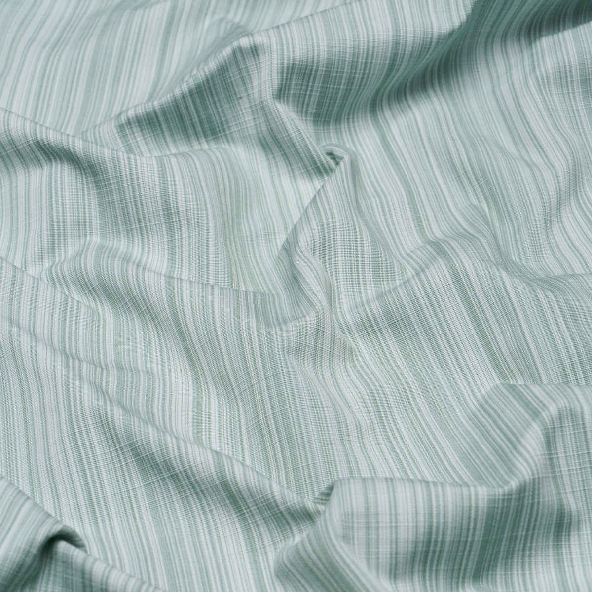 Gracie Solid Strié fabric in mint green color - pattern number 85931 - by Schumacher in the Mark D. Sikes collection