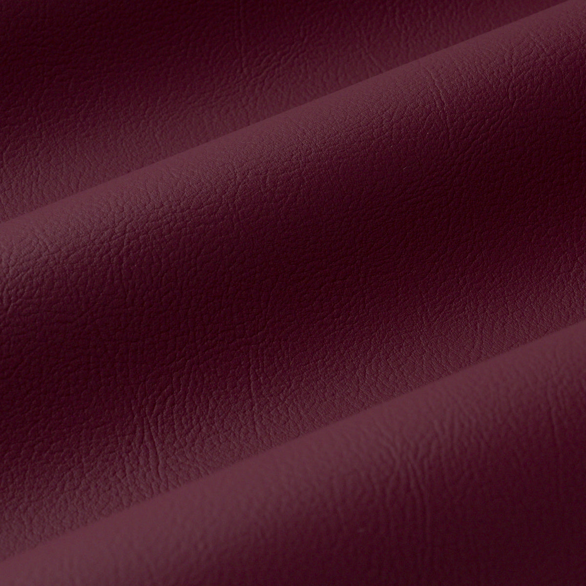 Vegan Leather Indoor/Outdoor fabric in merlot color - pattern number 87052 - by Schumacher in the Perfect Basics: Vegan Leather &amp; Suede collection