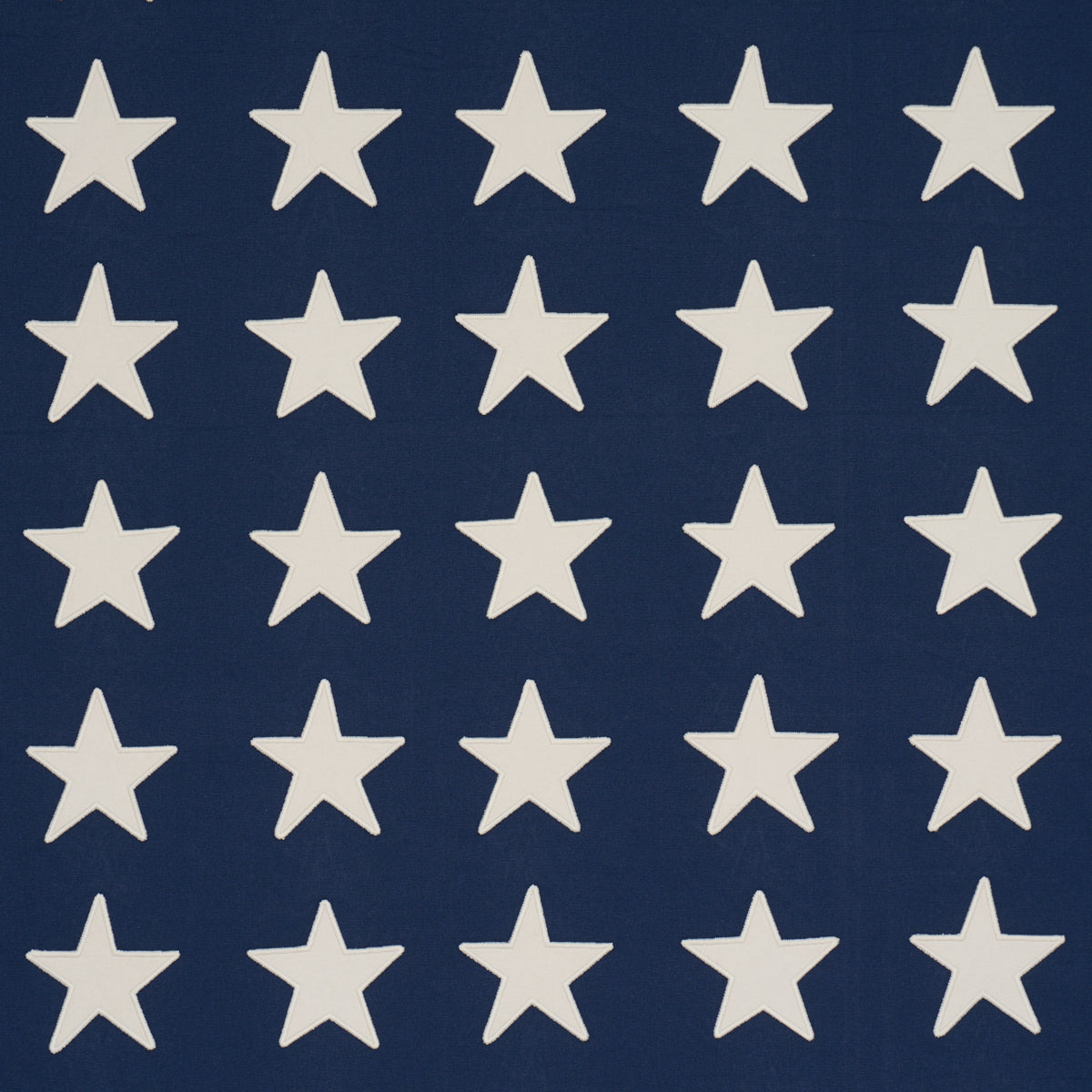 Starfield Applique fabric in Navy color - pattern number 87600 - by Schumacher in the Stars and Stripes collection
