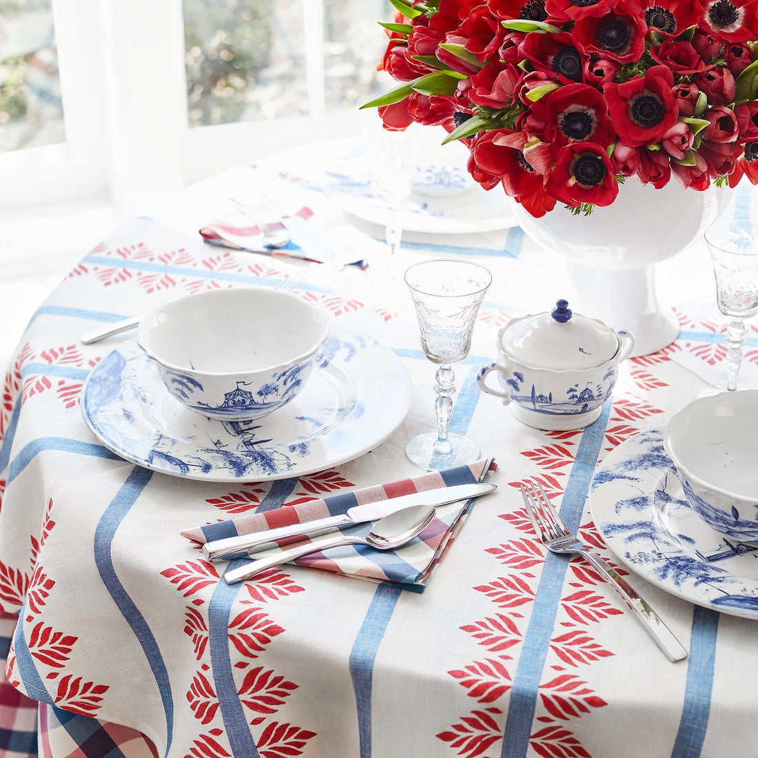 Detail of tablecloth in Fern Stripe printed fabric in Red and Blue - pattern number AF15105 - by Anna French in the Antilles collection