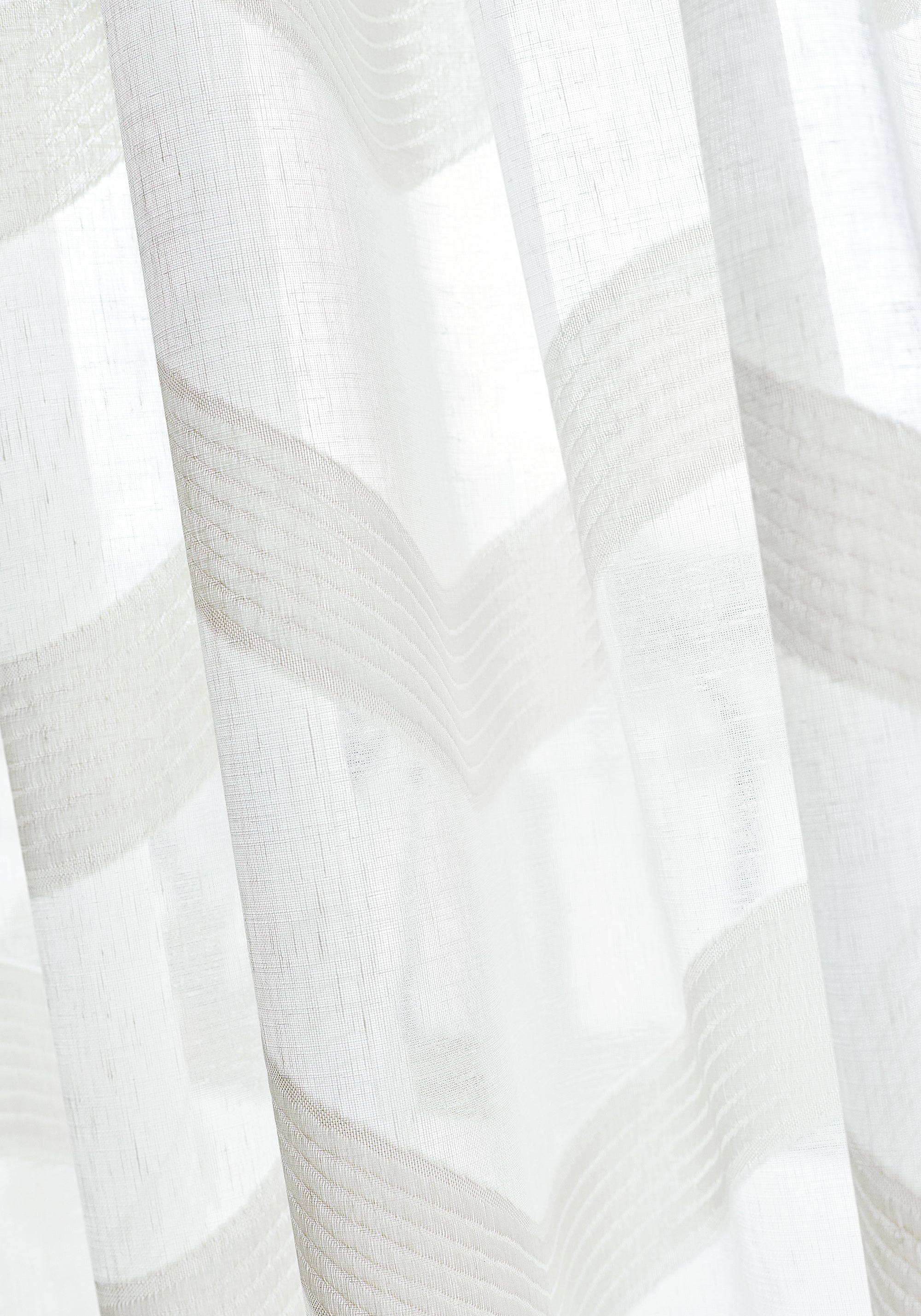 Closeup detail of Sheer curtains made with Thibaut Cassidy Sheer woven fabric in Snow White color pattern FWW7147