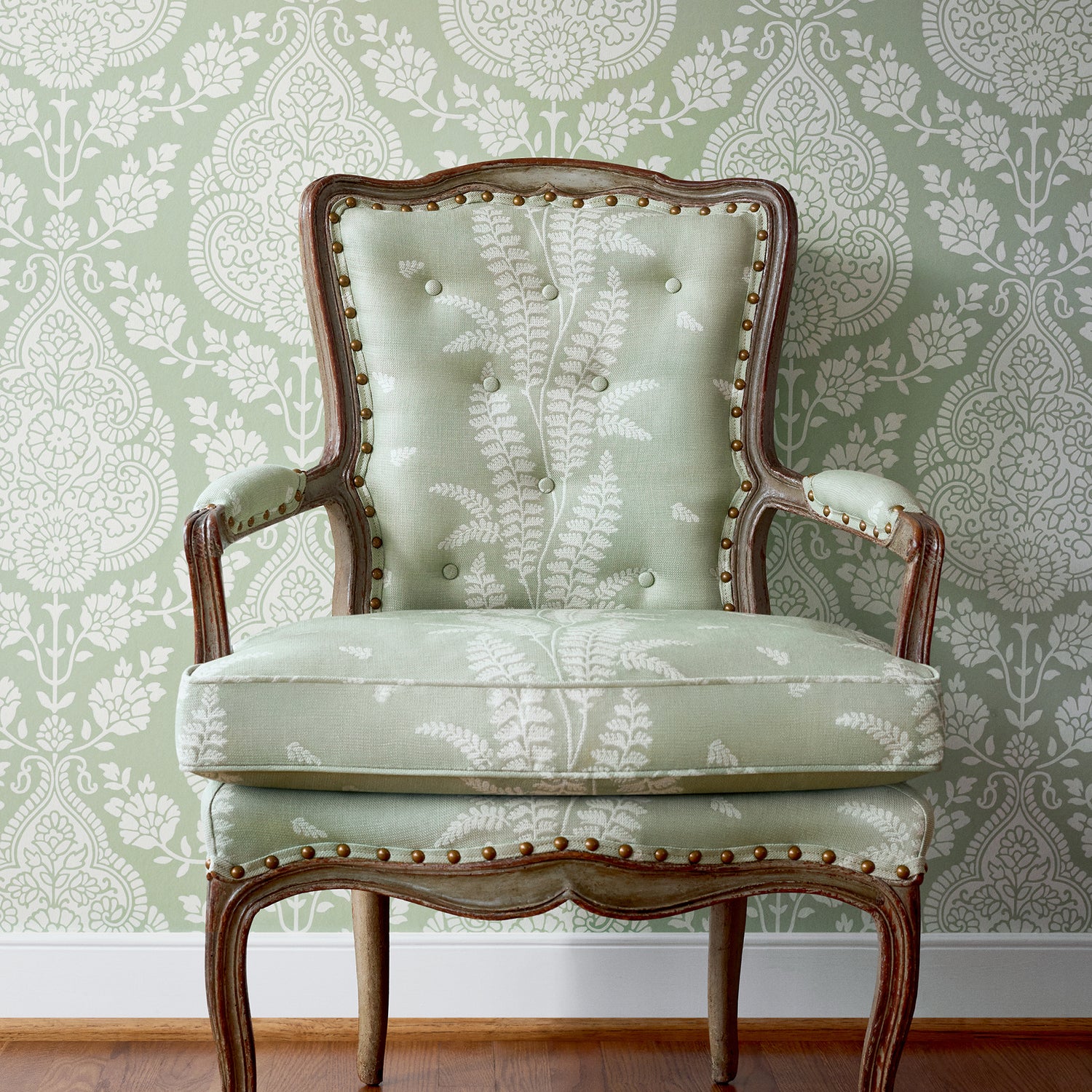 Detailed view of Chair in Ensbury Fern woven fabric in green color variant by Anna French in the Bristol collection - pattern number AW57826