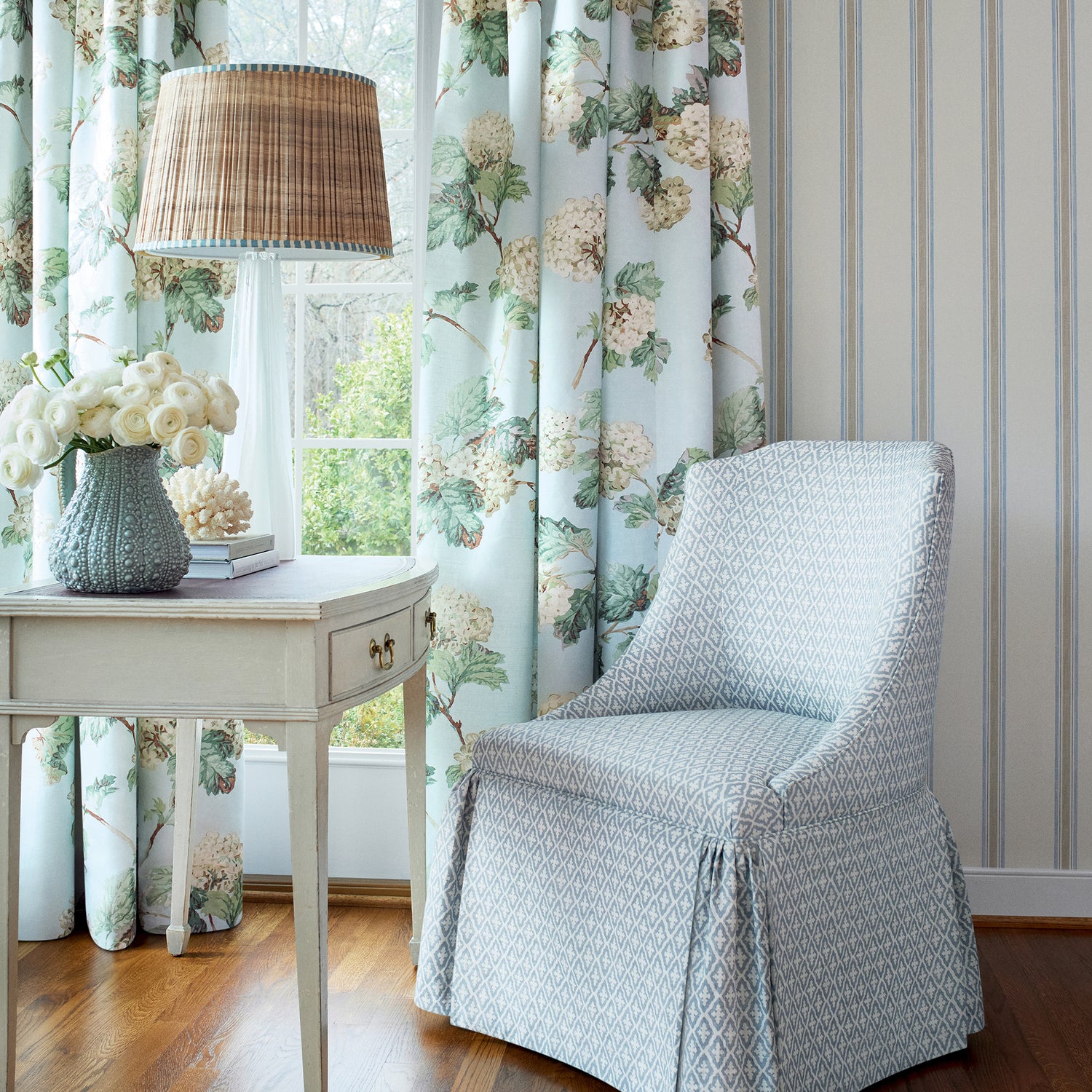 Draperies in Sussex Hydrangea printed fabric in soft blue color - pattern number AF57845 by Anna French in the Bristol collection