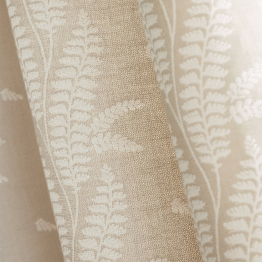 Detailed view of Ensbury Fern woven fabric in beige color variant by Anna French in the Bristol collection - pattern number AW57824