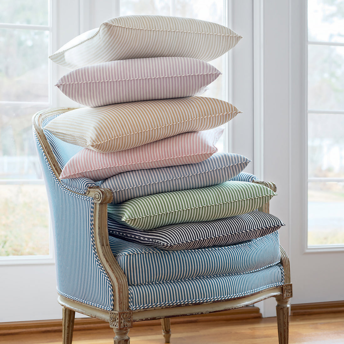 Collection of chair and pillow fabrics in Holden Stripe woven fabric featuring soft gold color fabric - pattern number AW57803 - by Anna French in the Bristol collection