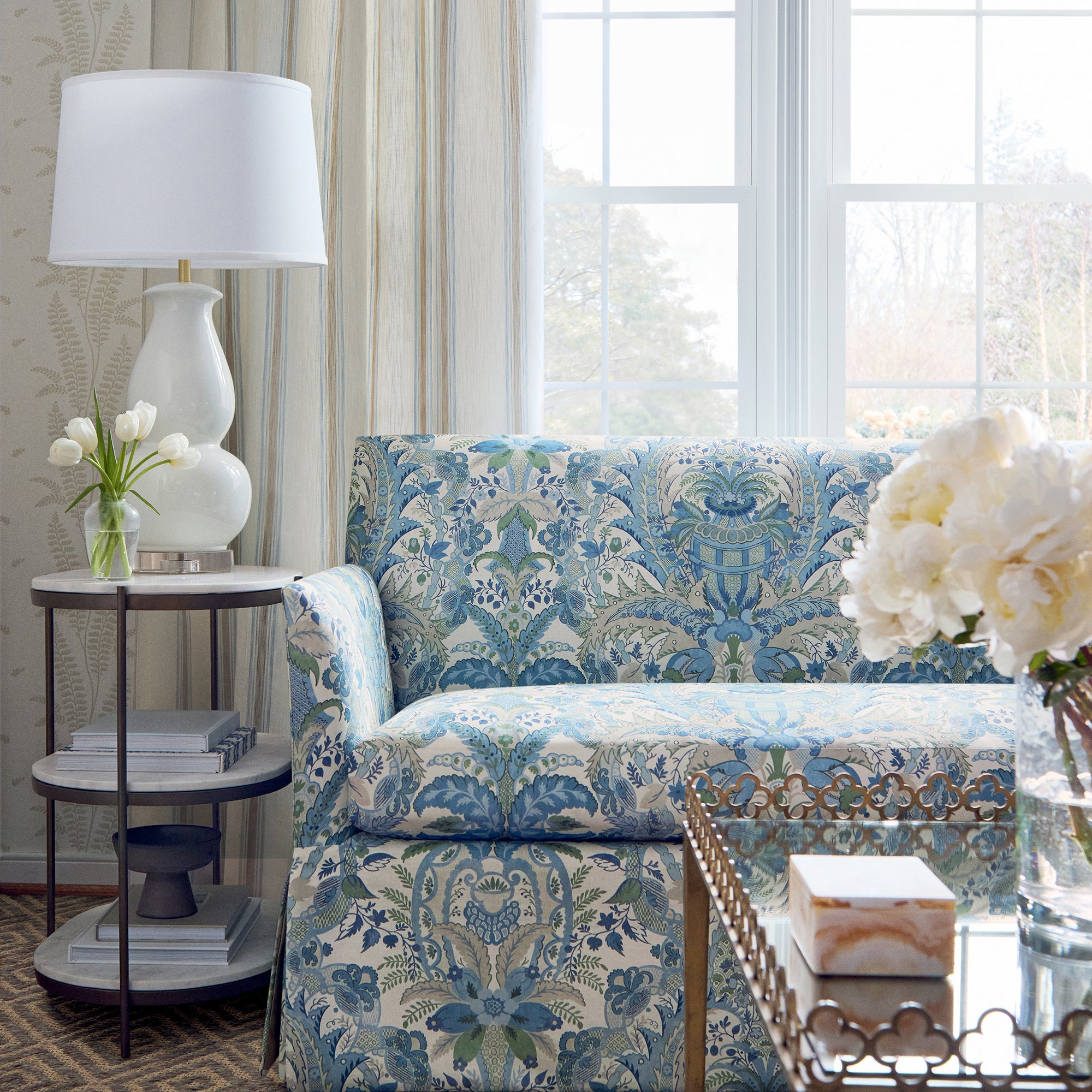 Detailed view of Addison Sofa with Skirt in Narbeth printed fabric in blue and green color variant by Anna French in the Bristol collection - pattern number AF57858