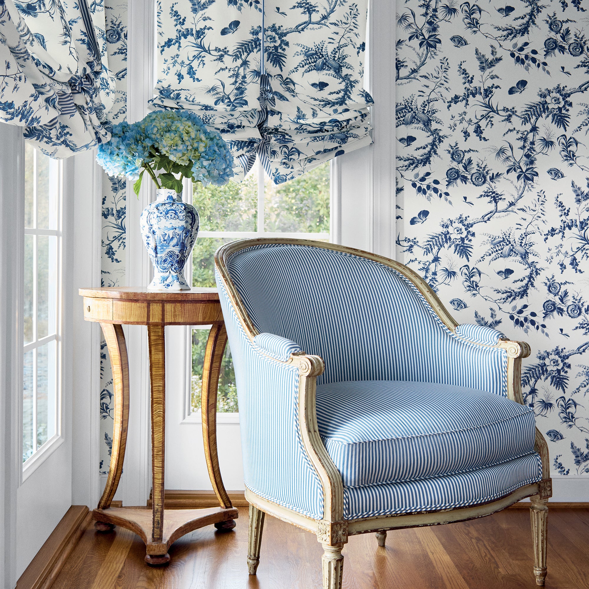 Roman shades in Newlands Toile printed fabric in blue color - pattern number AF57837 by Anna French in the Bristol collection