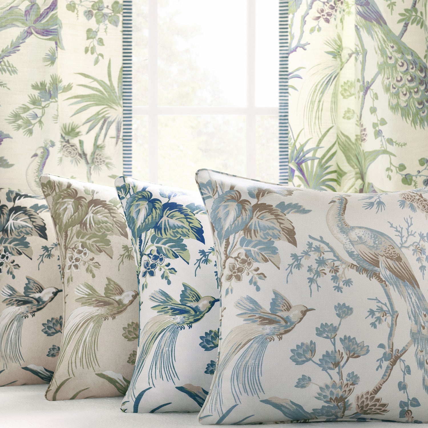 Collection of draperies and pillow fabrics in Peacock toile printed fabric featuring soft blue and beige color fabric - pattern number AF57828 - by Anna French in the Bristol collection