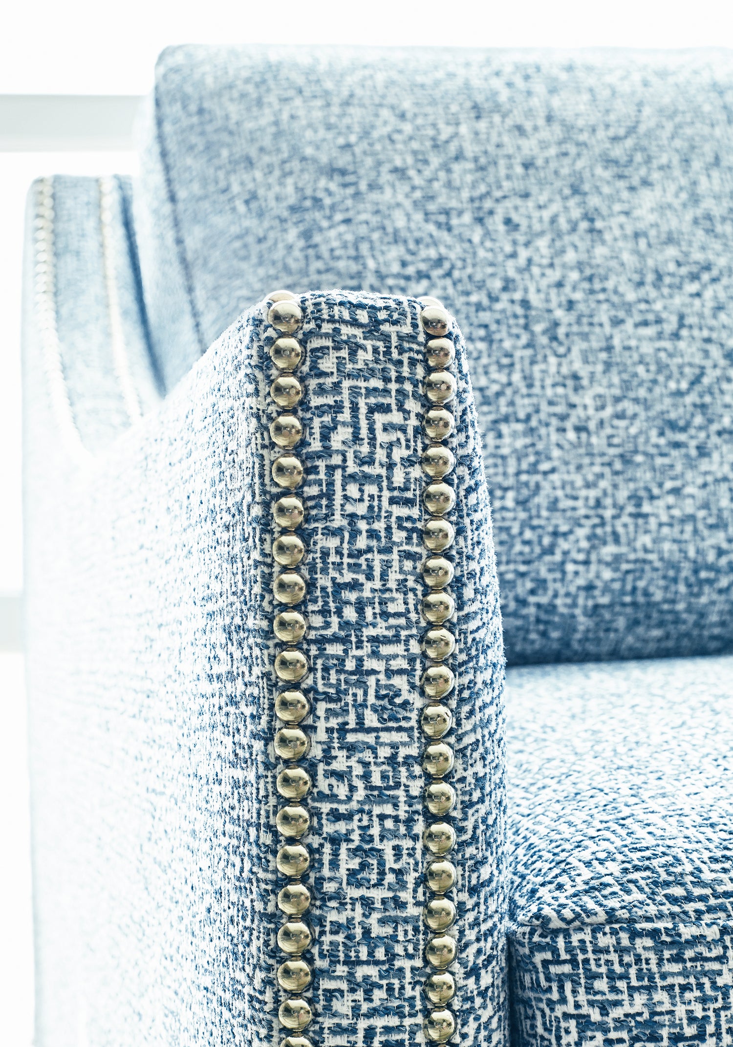 Closeup detail of Westwood Chair upholstered in Thibaut Mandela woven fabric in Blue color - pattern W74053