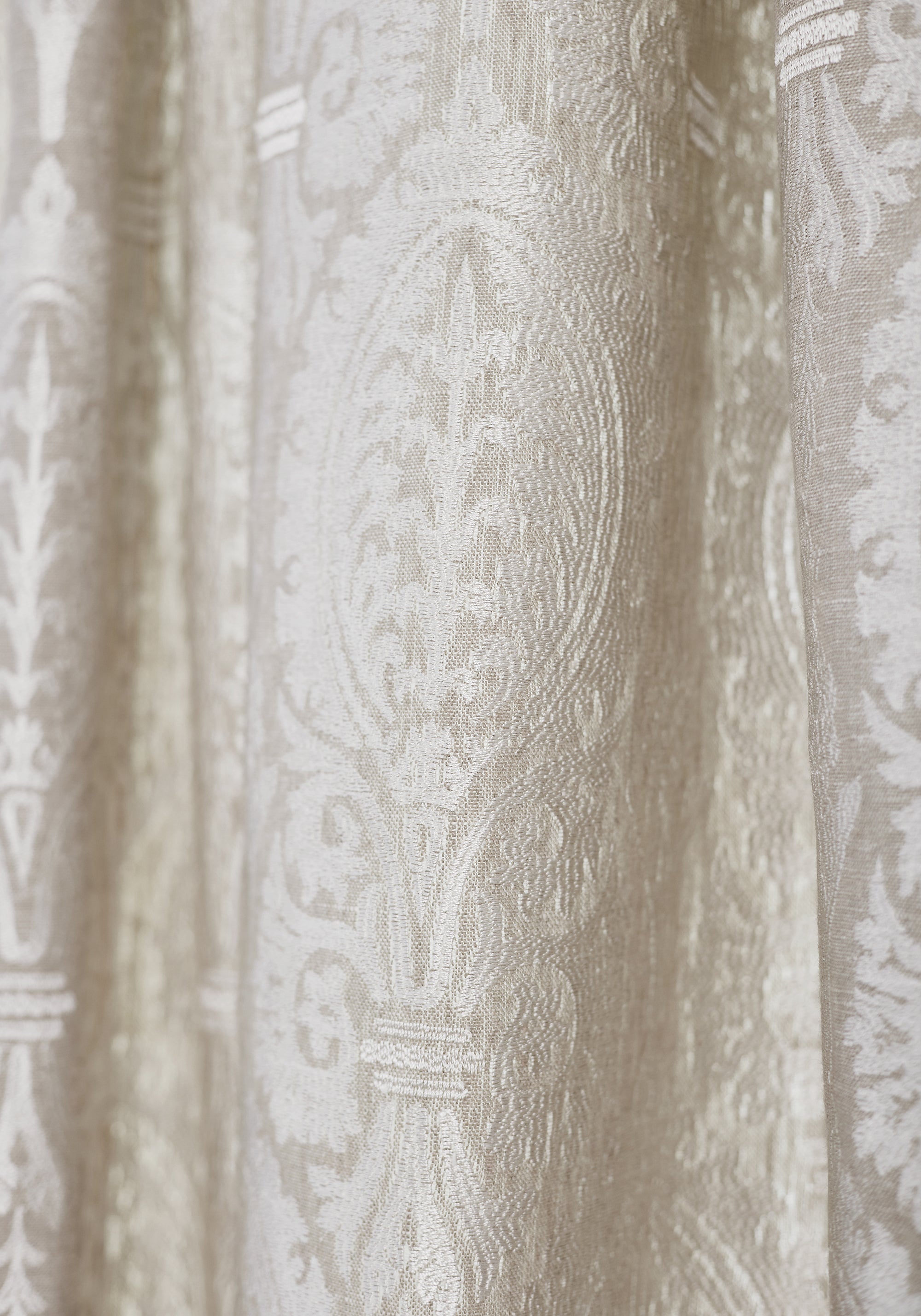 Detailed view of Sir Thomas Embroidery woven fabric in flax color variant by Thibaut in the Chestnut Hill collection - pattern number W772569