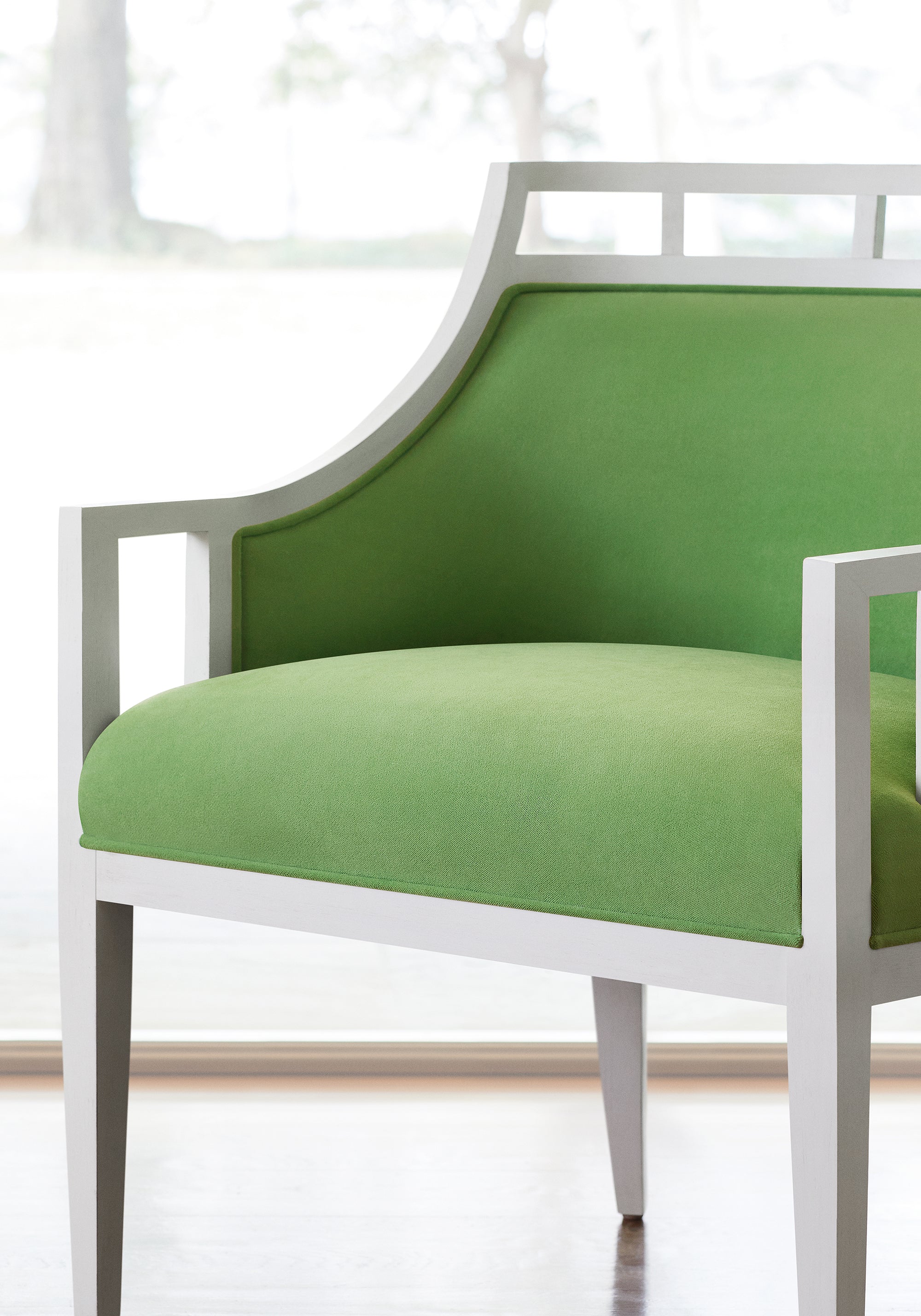 Detailed view of Malibu Chair in Club Velvet sustainable woven fabric in grass color variant by Thibaut in the Club Velvet collection - pattern number W7254