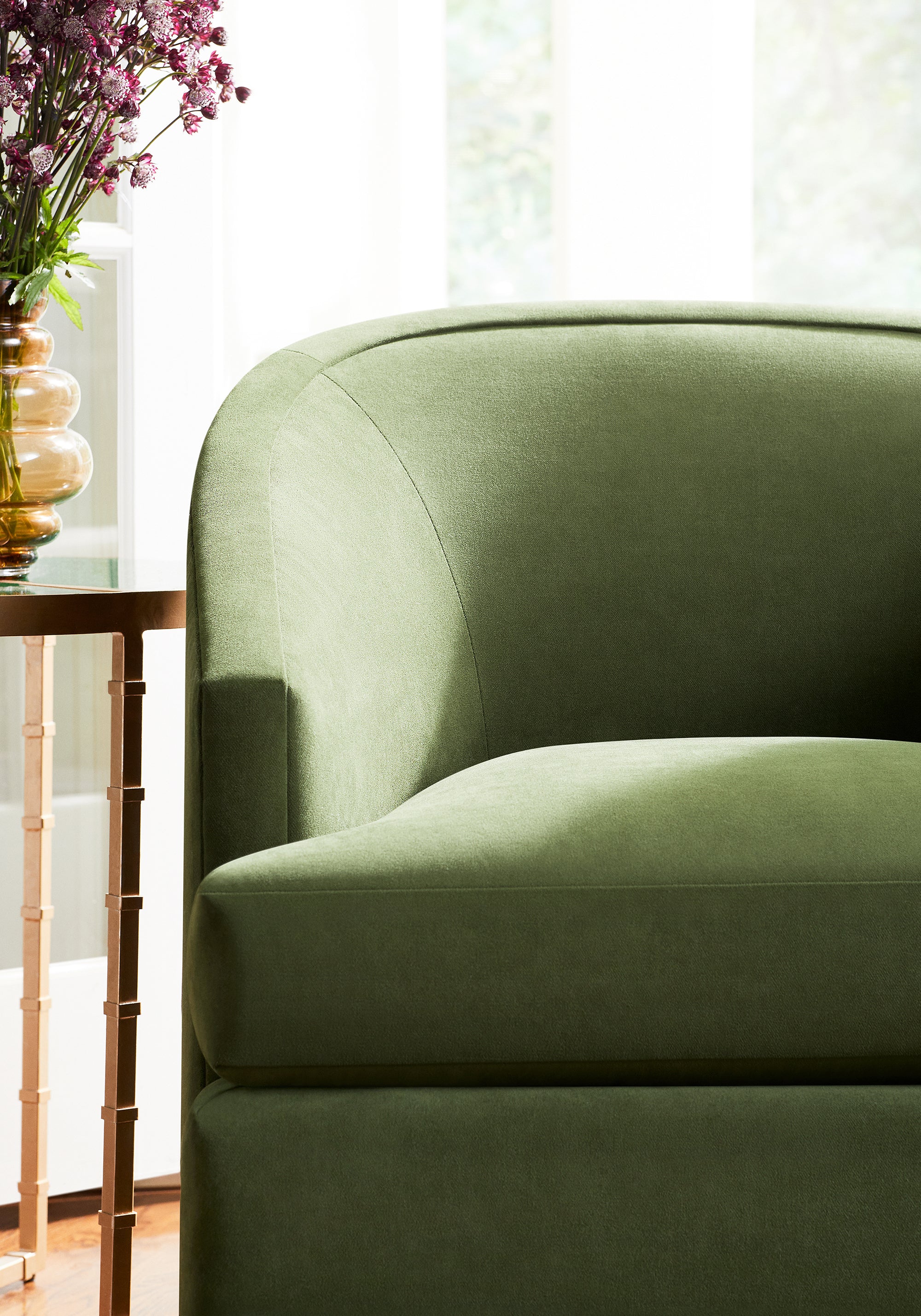 Detailed view of Dexter Chair in Club Velvet sustainable woven fabric in ivy color variant by Thibaut in the Club Velvet collection - pattern number W7253