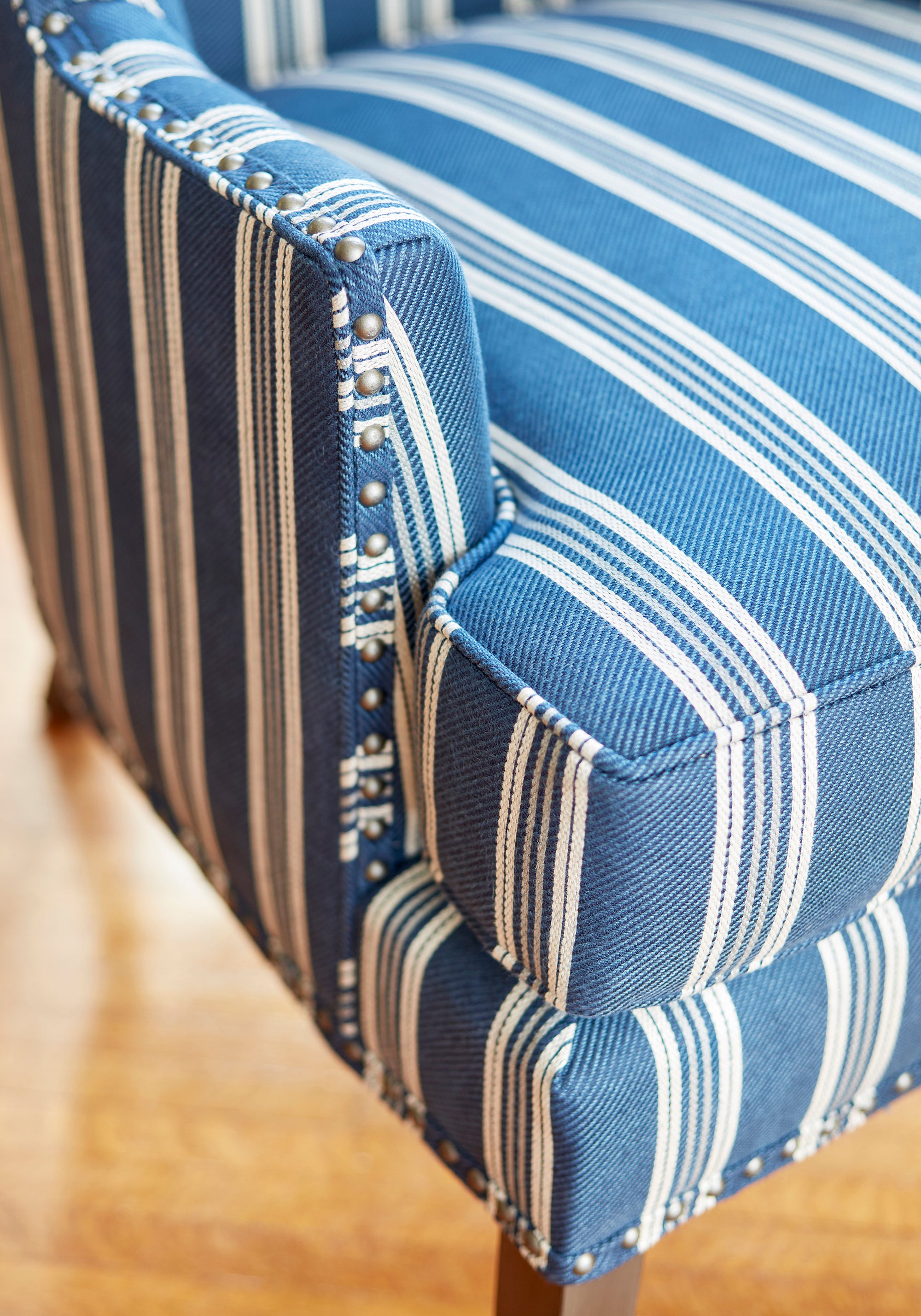 Detailed view of Monterey Chair in Colonnade Stripe woven fabric in navy color - pattern number W80735 by Thibaut in the Woven Resource Vol 11 Rialto collection