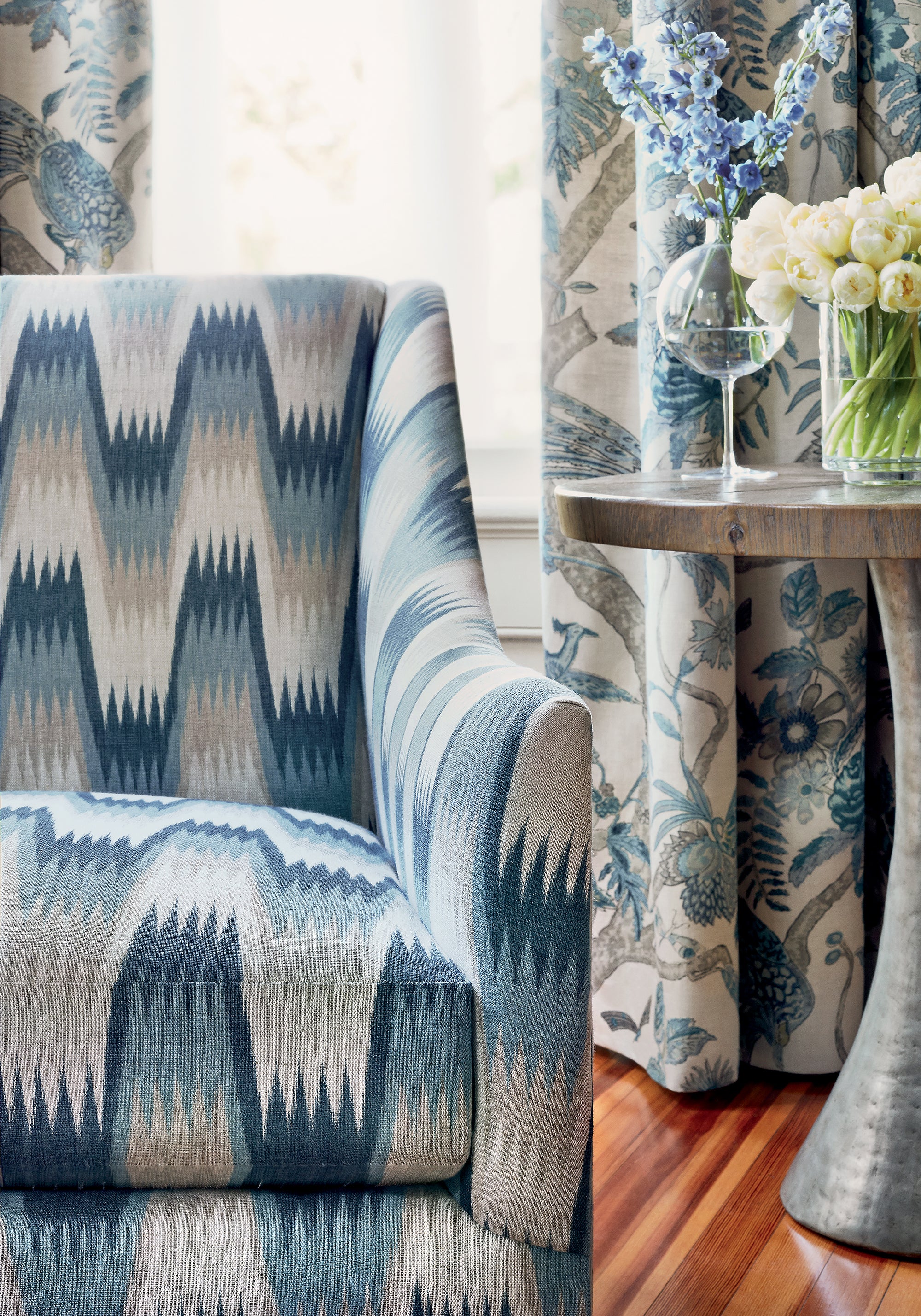 Detailed view of Saybrook chair in Stockholm Chevron printed fabric in slate blue color variant by Thibaut in the Colony collection - pattern number F910241