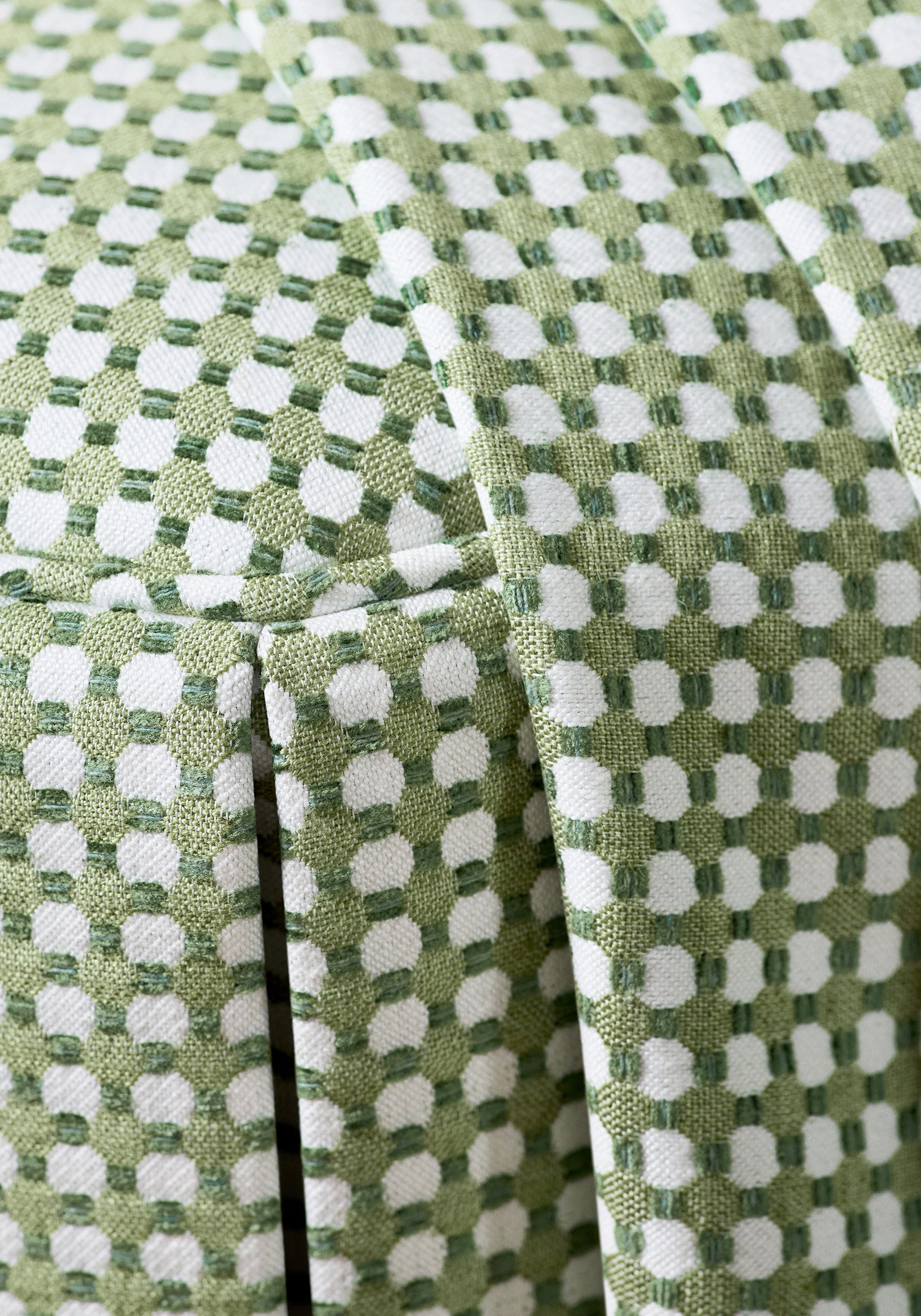 Detailed view of Octavio Ottoman in Darcy woven fabric in leaf color variant by Anna French in the Bristol collection - pattern number W81918