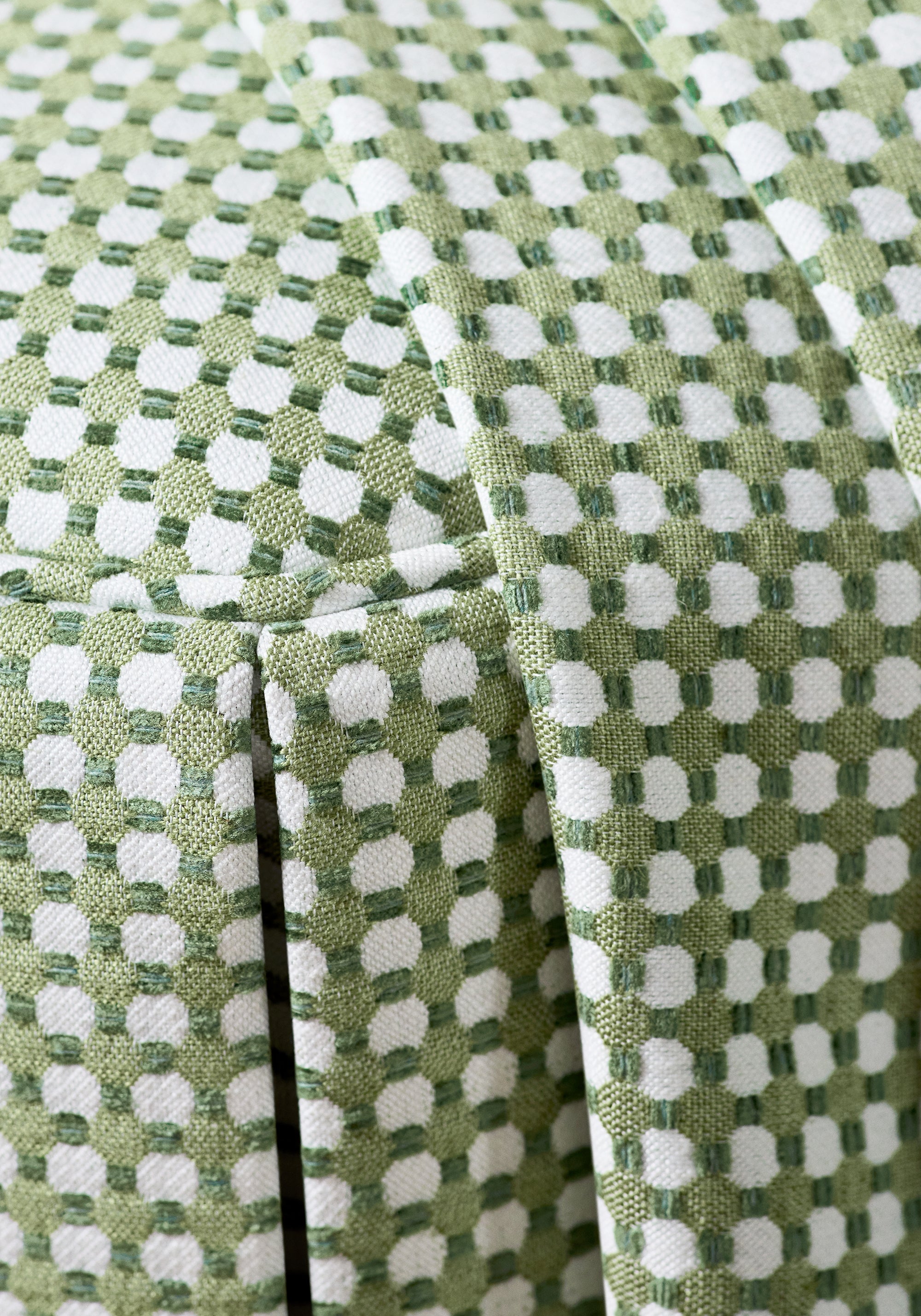 Detailed view of Octavio Ottoman in Darcy woven fabric in leaf color variant by Anna French in the Bristol collection - pattern number W81918