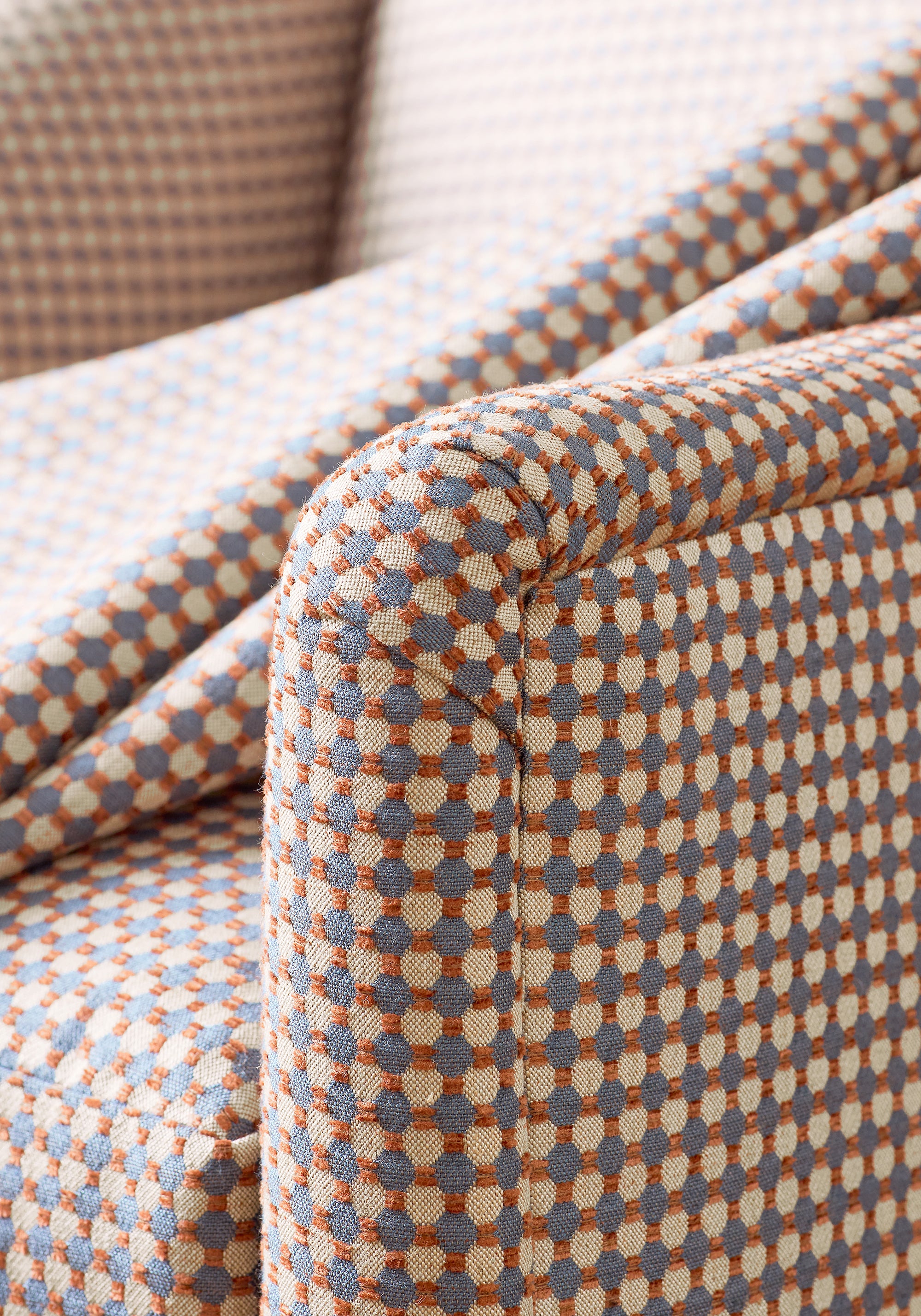 Detailed view of Stanwick Chair in Darcy woven fabric in campfire color variant by Anna French in the Bristol collection - pattern number W81924