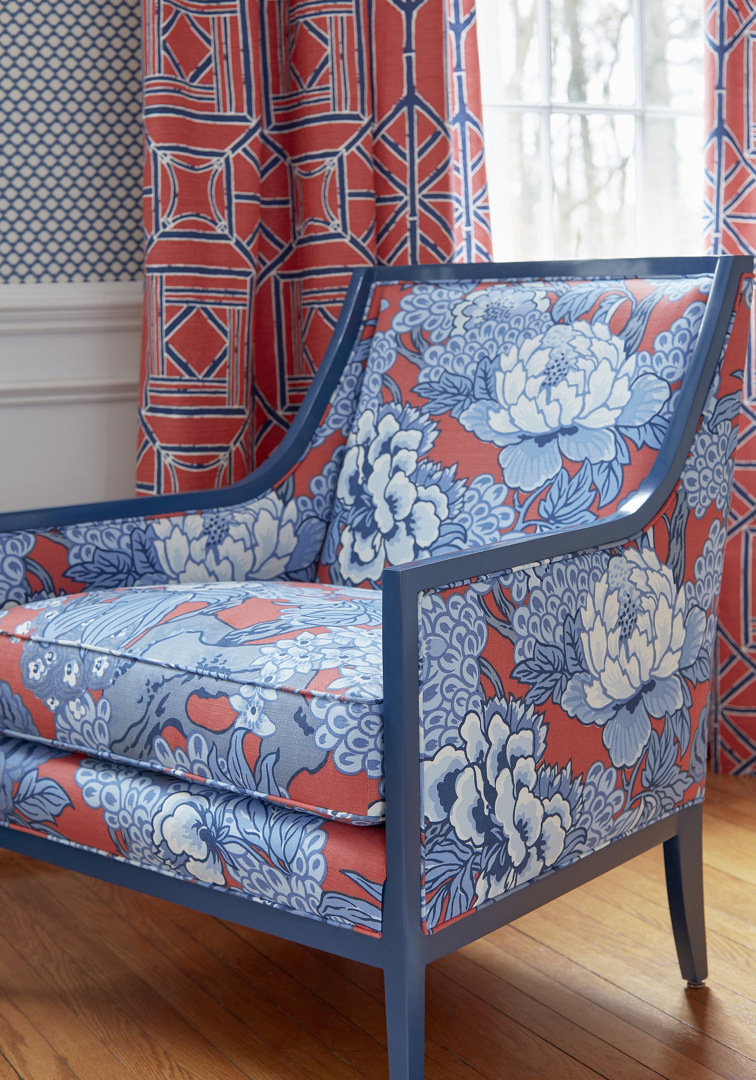 Detailed view of Pasadena Chair in Honshu printed fabric in red and blue color variant by Thibaut in the Dynasty collection - pattern number F975489