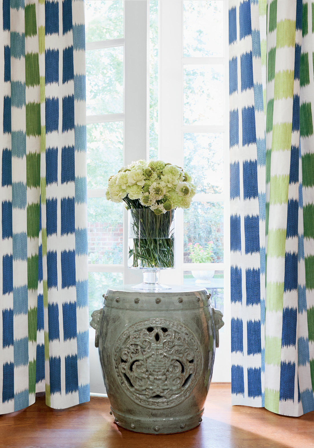 Draperies in Kasuri printed fabric in blue and green color - pattern number F920839 by Thibaut in the Eden collection