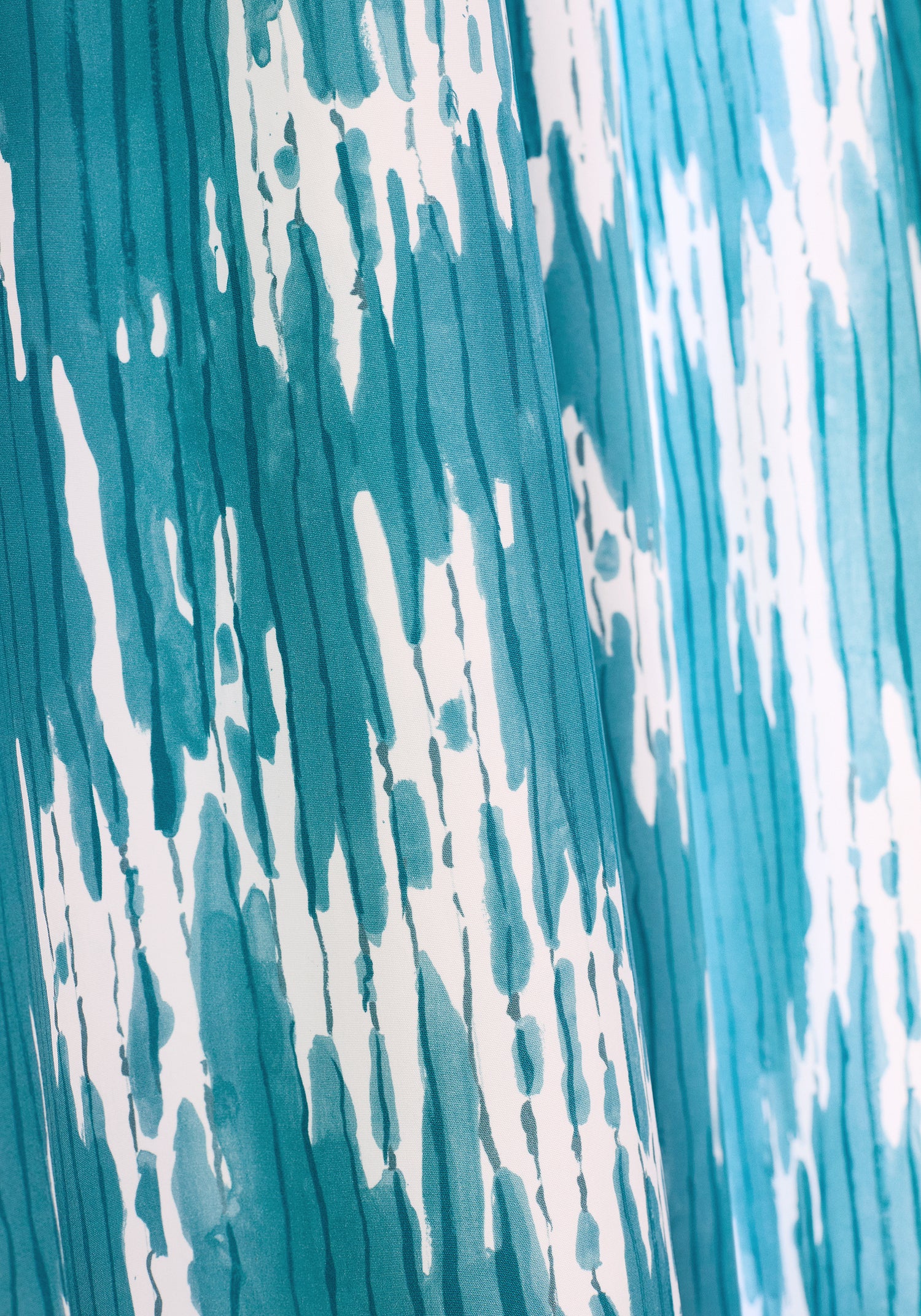 Detailed view of Maverick printed fabric in teal color variant by Thibaut in the Eden collection - pattern number F920816