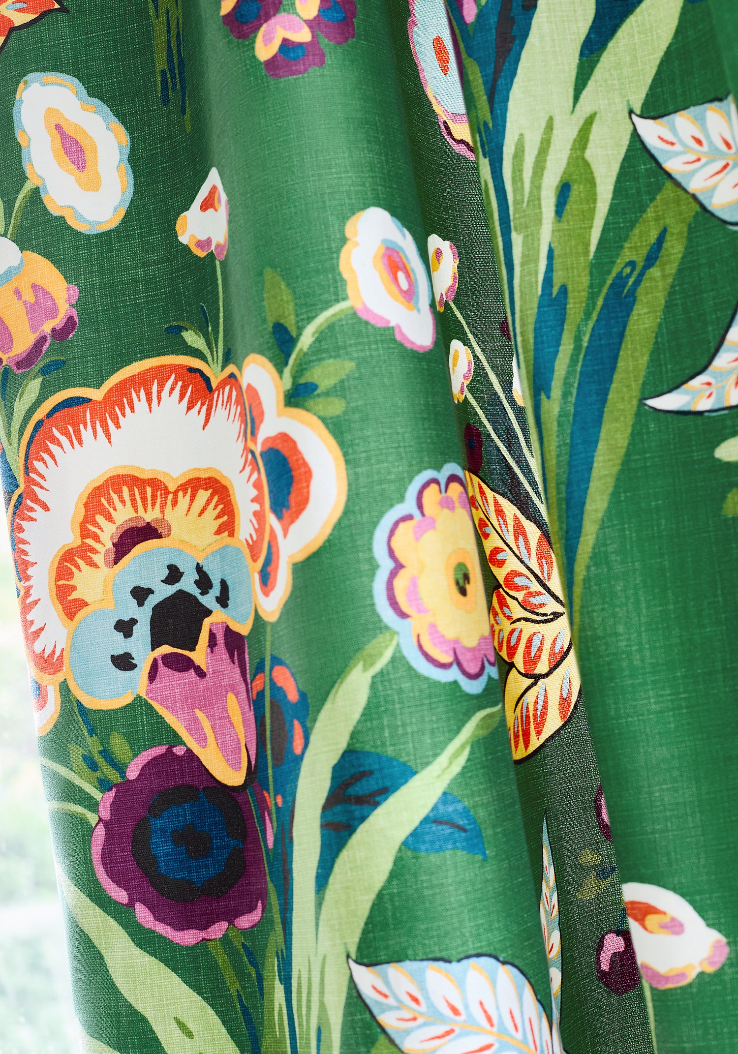 Detailed view of draperies in Pasadena printed fabric in emerald color variant by Thibaut in the Eden collection - pattern number F920849