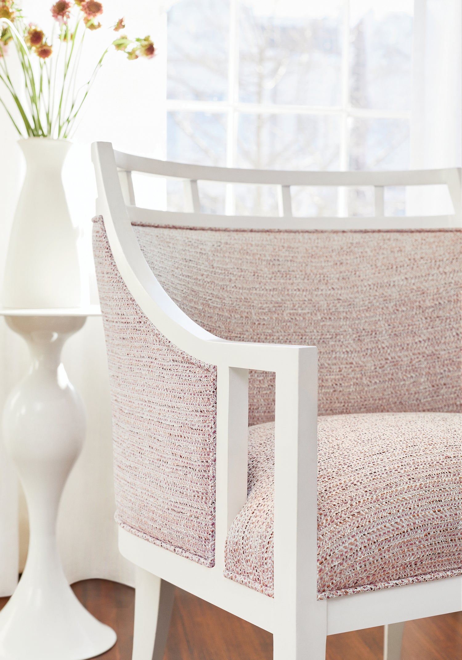 Closeup of Malibu Chair in Thibaut Elements woven fabric in Blush color - pattern number W75246