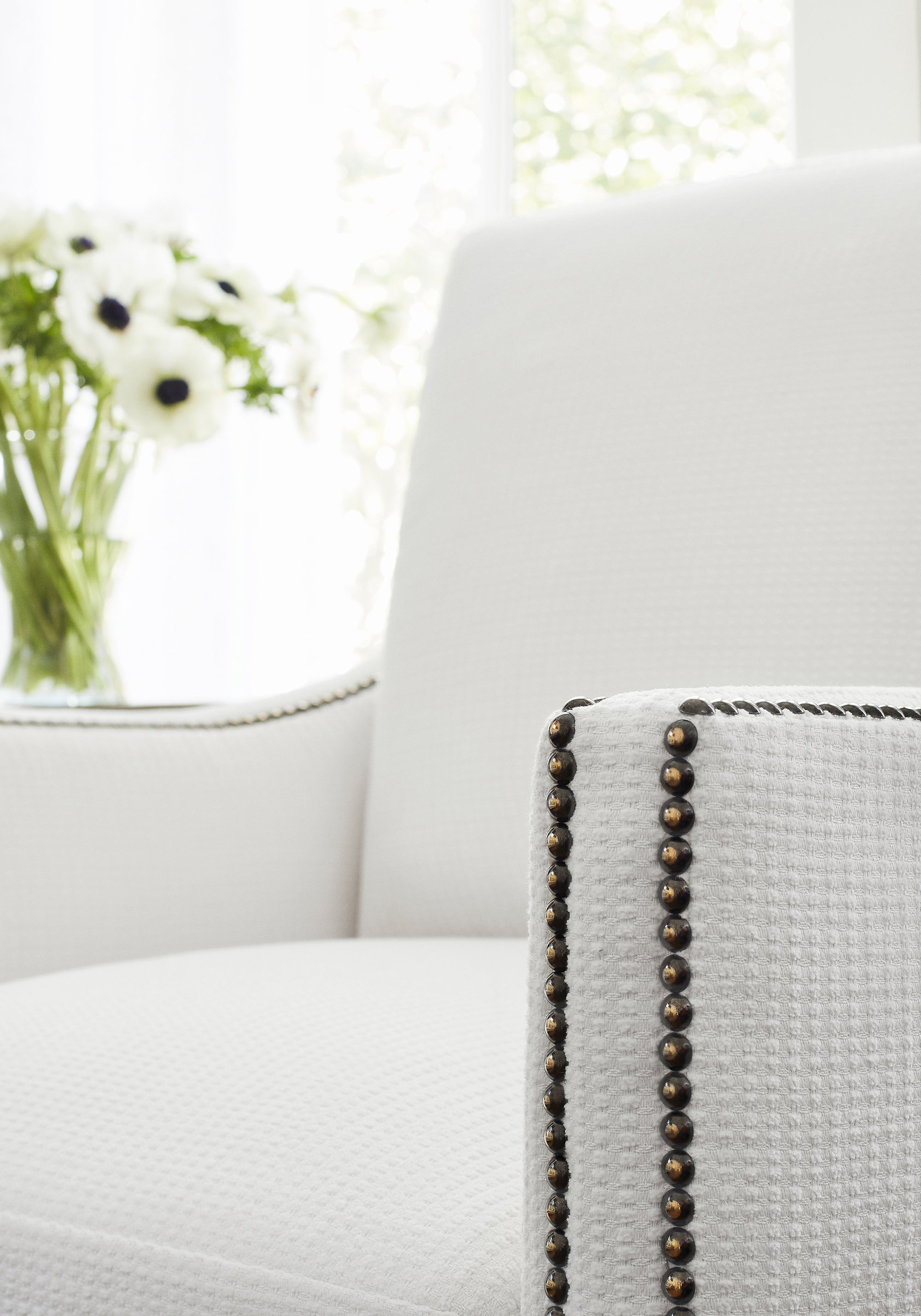 Closeup of Westwood Chair in Thibaut Stratus woven fabric in Ivory color - pattern number W75225
