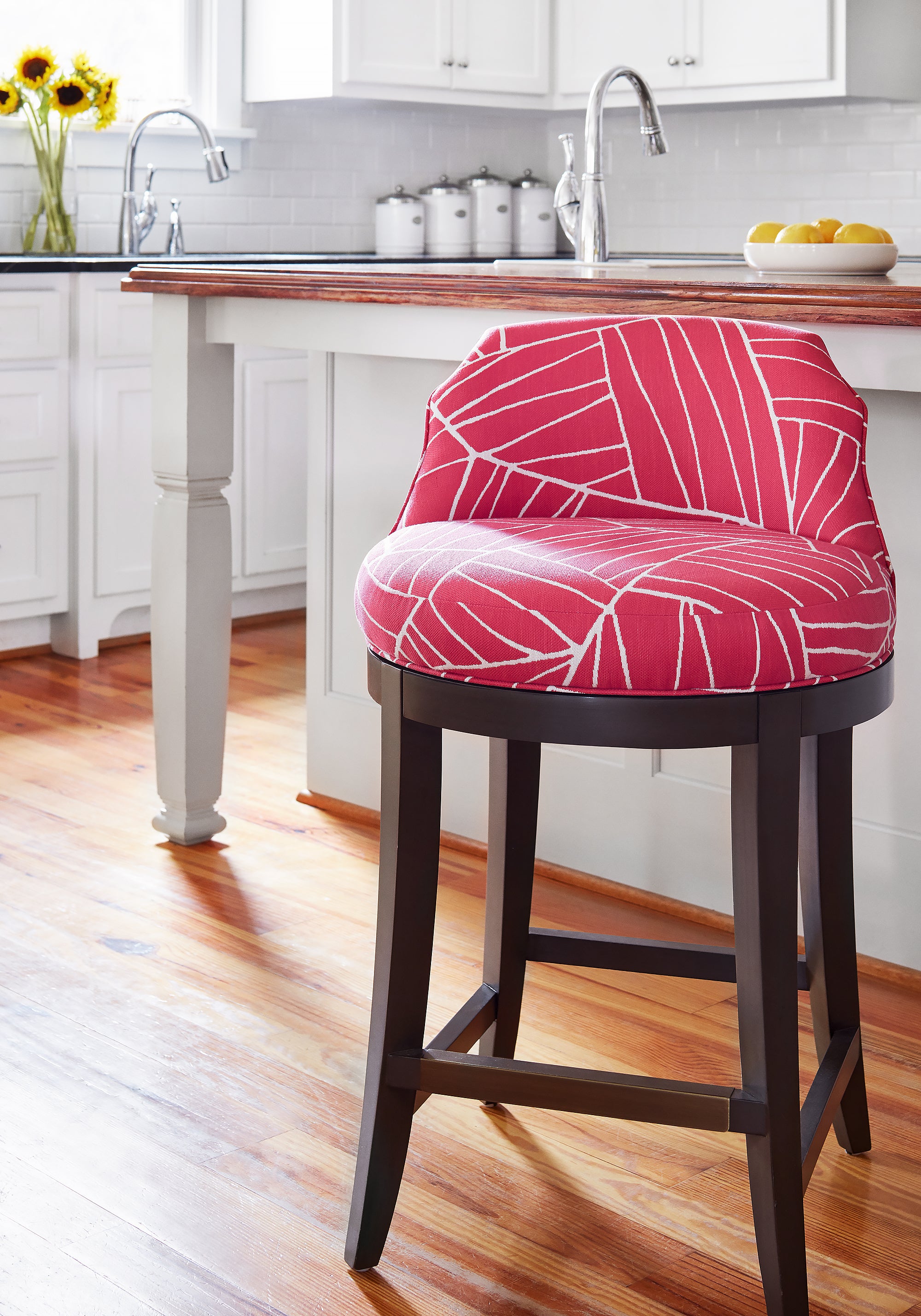 Detailed view of Bailey swivel barstool in Jordan woven stain resistant fabric in magenta color variant by Thibaut in the Festival collection - pattern number W74649