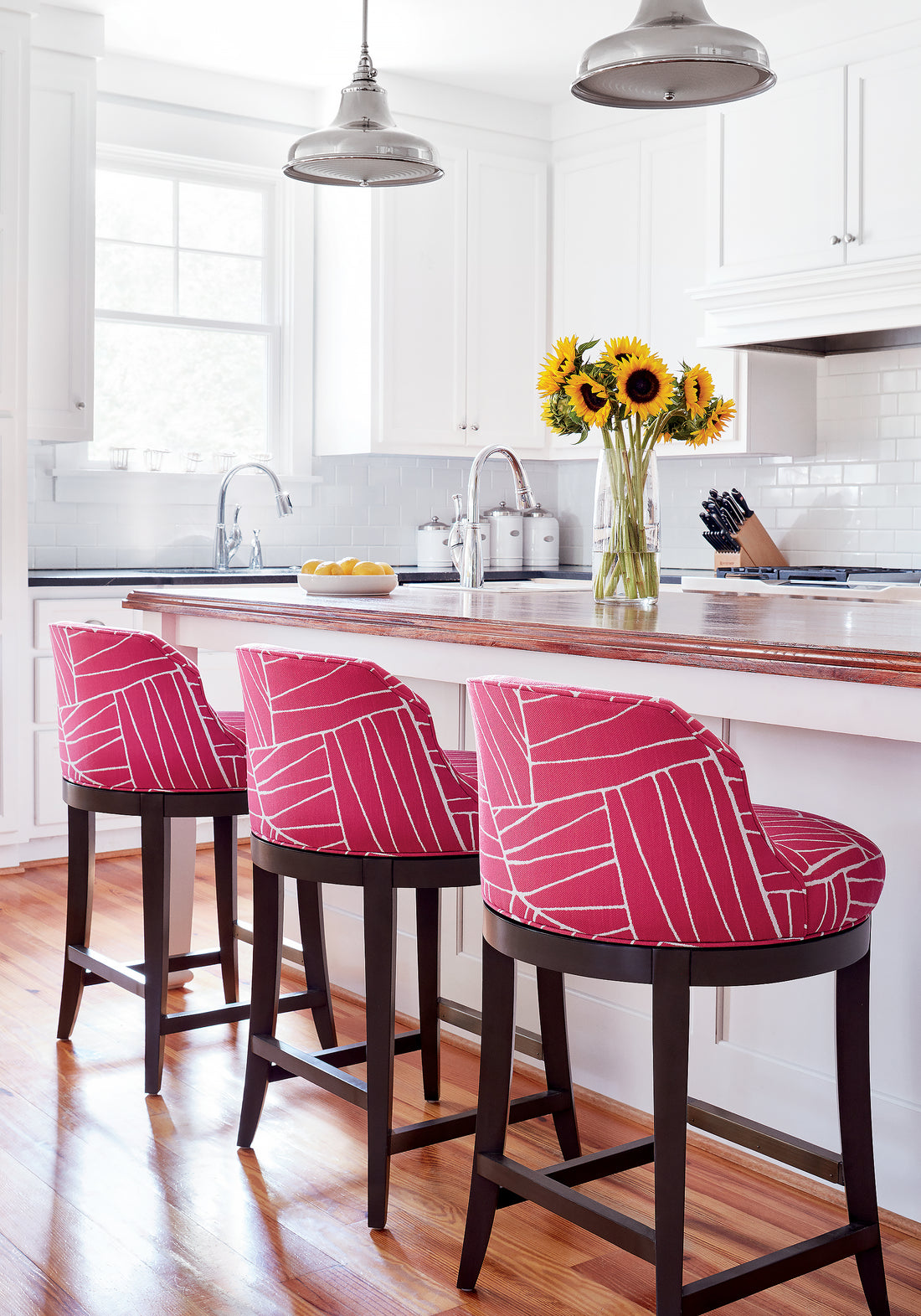 Bailey swivel barstools in Jordan woven stain resistant fabric in magenta color - pattern number W74649 by Thibaut in the Festival collection