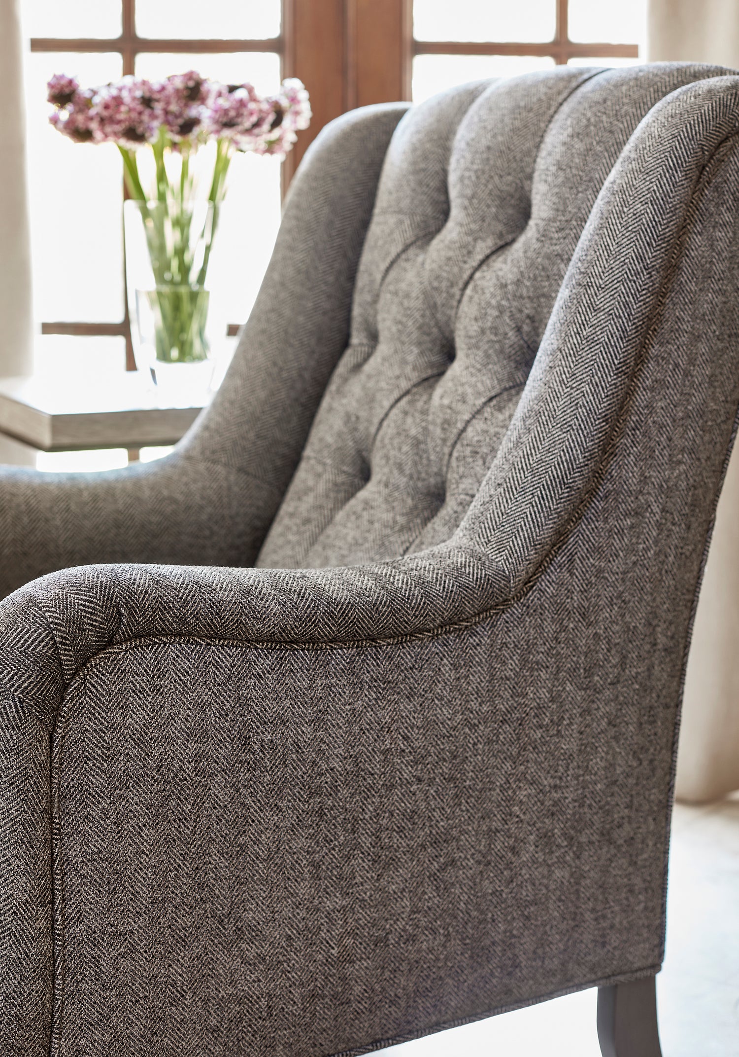 Detailed view of Newport Wing Chair in Hadrian Herringbone woven fabric in charcoal color - pattern number W80713 by Thibaut in the Woven Resource Vol 11 Rialto collection