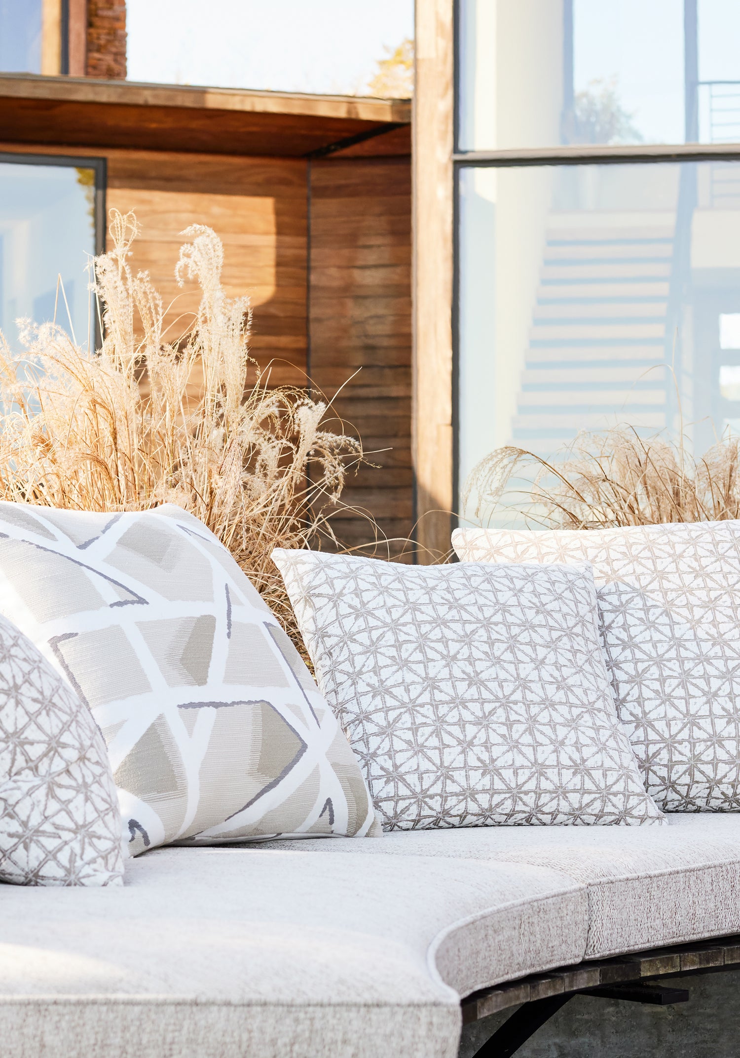 Close view of cushion featuring Arroyo fabric in latte color - pattern number W8782 - by Thibaut in the Haven Textures collection