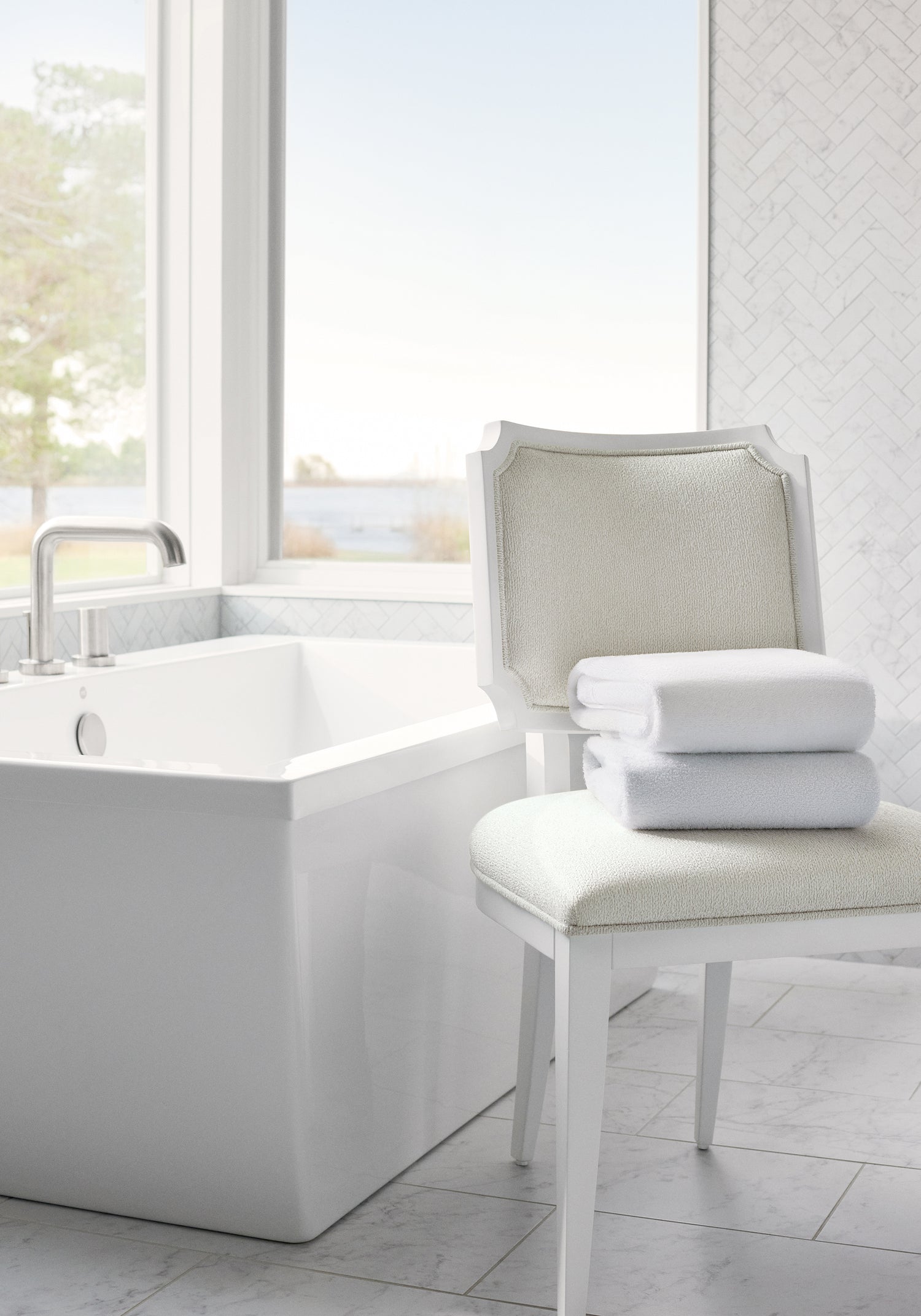 Bathroom chair featuring Athena fabric in pearl color - pattern number W8732 - by Thibaut in the Haven Textures collection