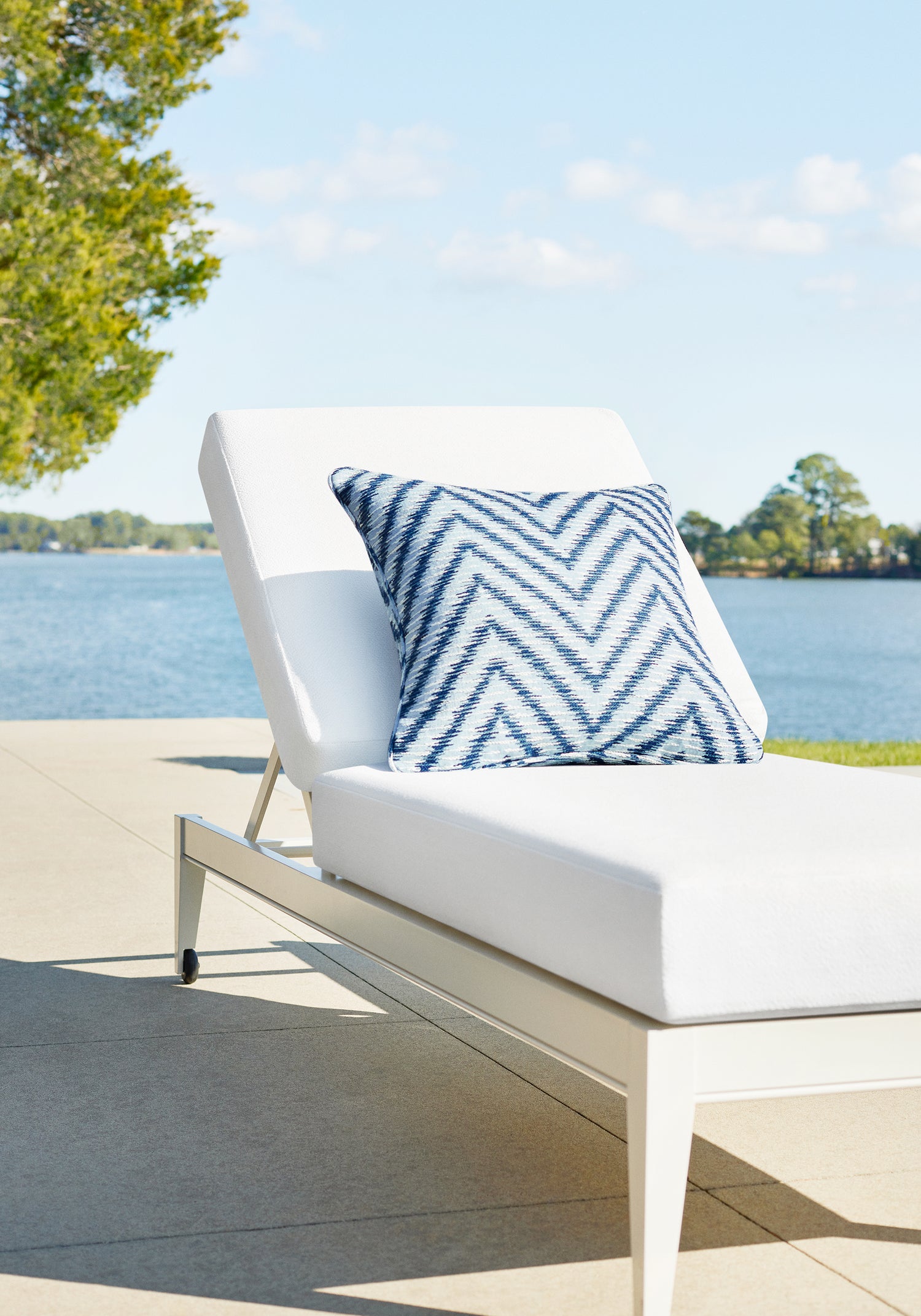 Close view of outdoor bed featuring Freya fabric in bleach white color - pattern number W8728 - by Thibaut in the Haven Textures collection