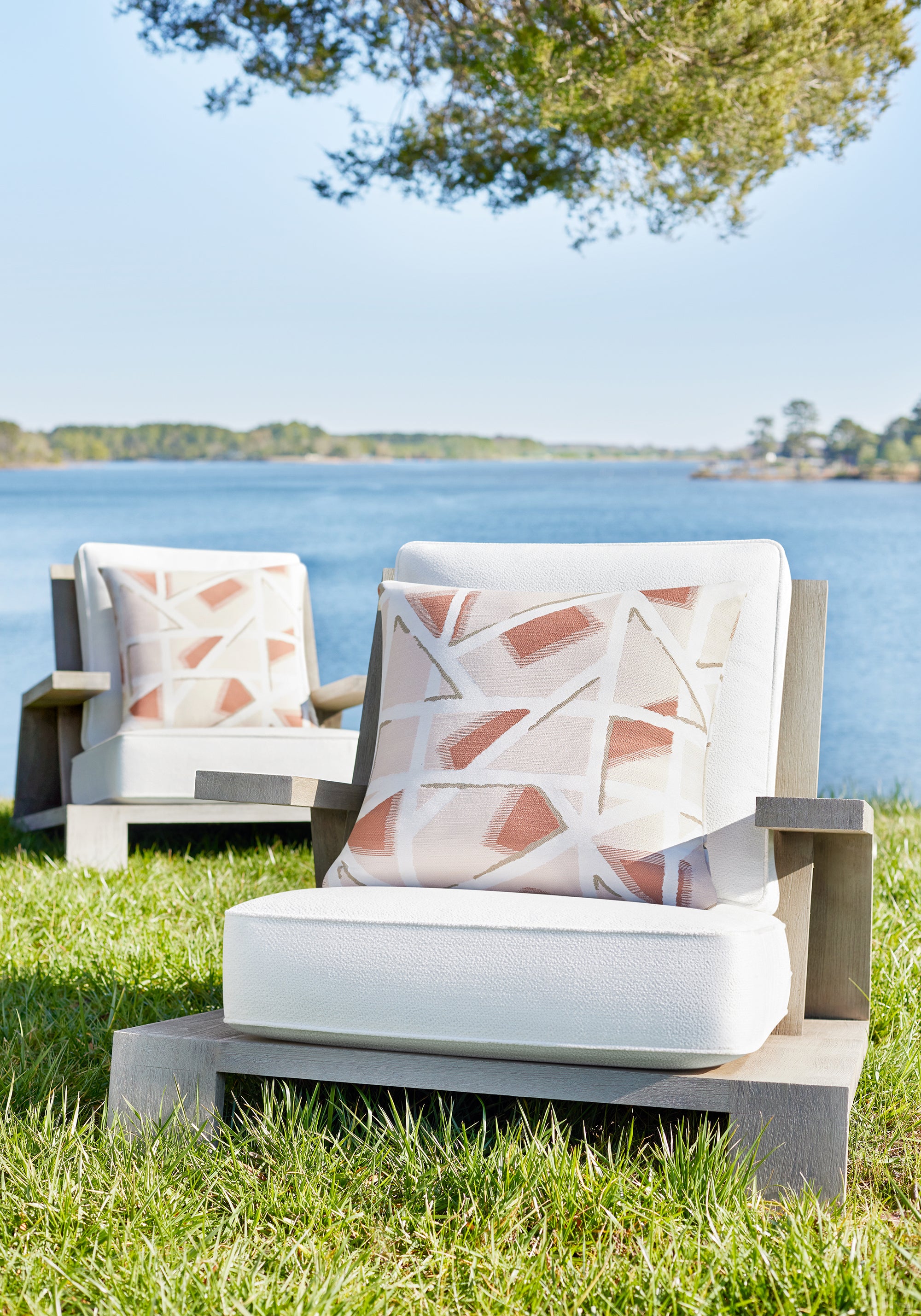 Close view of outdoor chairs featuring Freya fabric in bleach white color - pattern number W8728 - by Thibaut in the Haven Textures collection