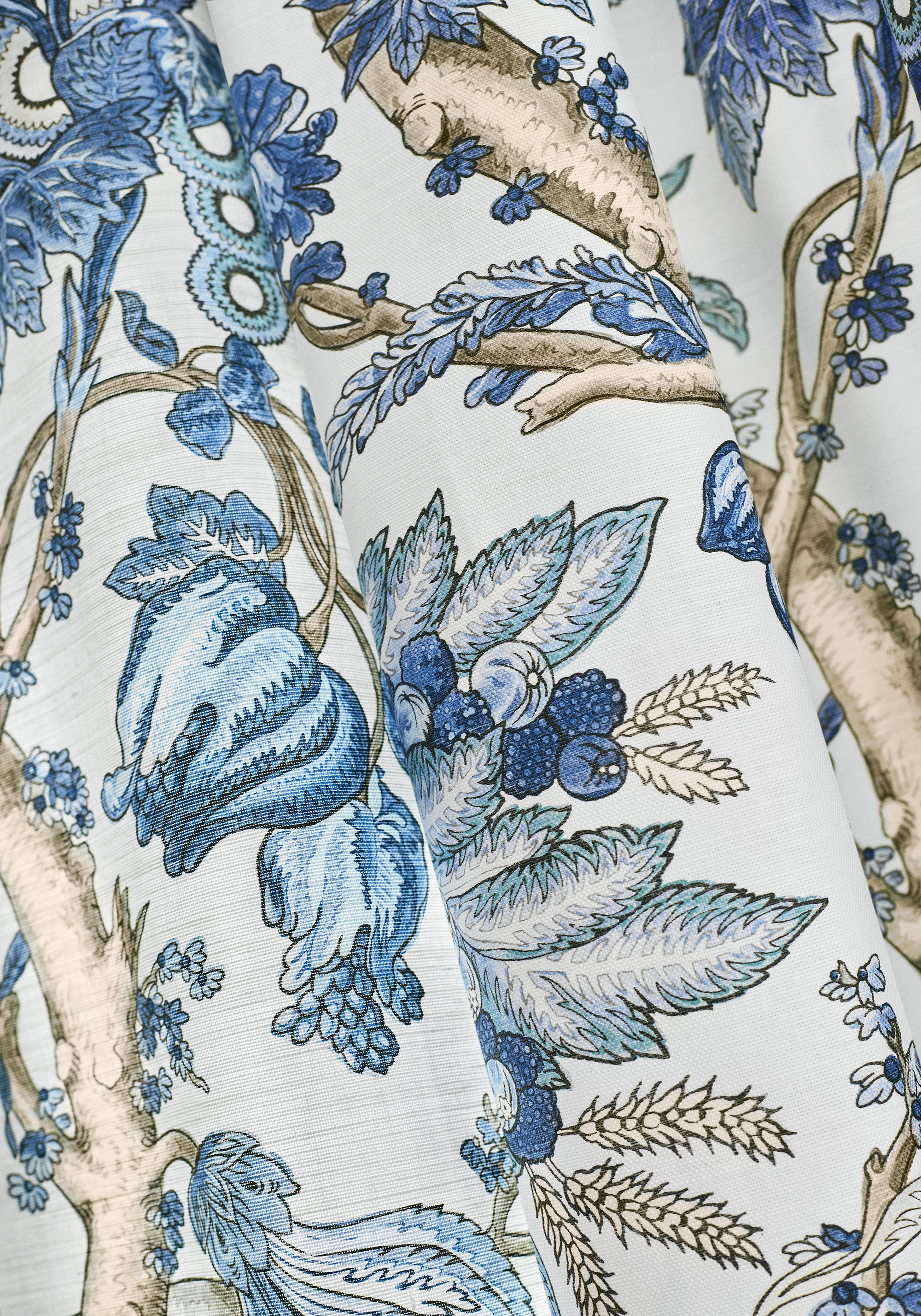 Detailed view of drapery in Chatelain printed fabric in blue and white color variant by Thibaut in the Heritage collection - pattern number F910846