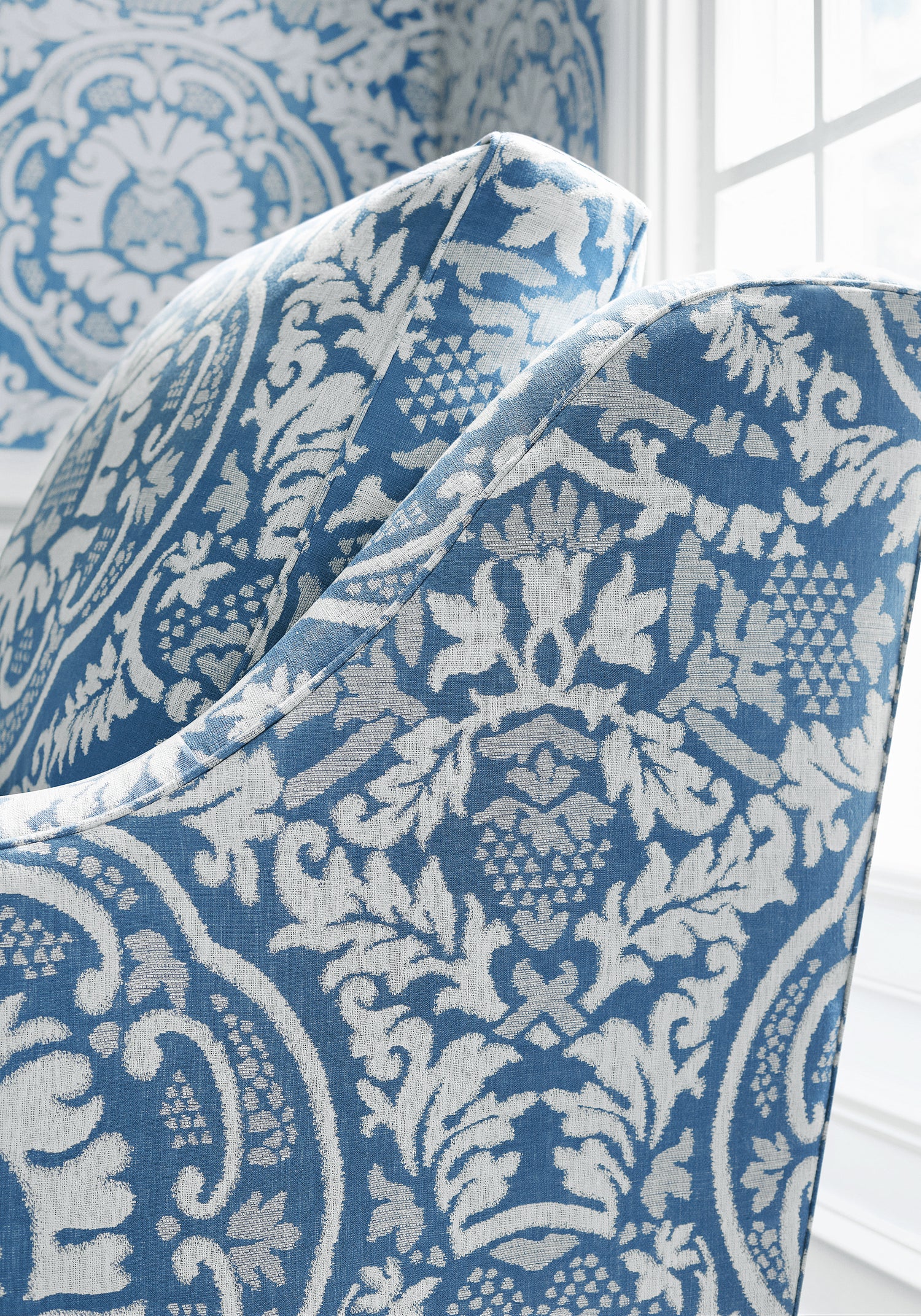 Detailed view of Earl Damask woven fabric in blue color variant by Thibaut in the Heritage collection - pattern number W710837