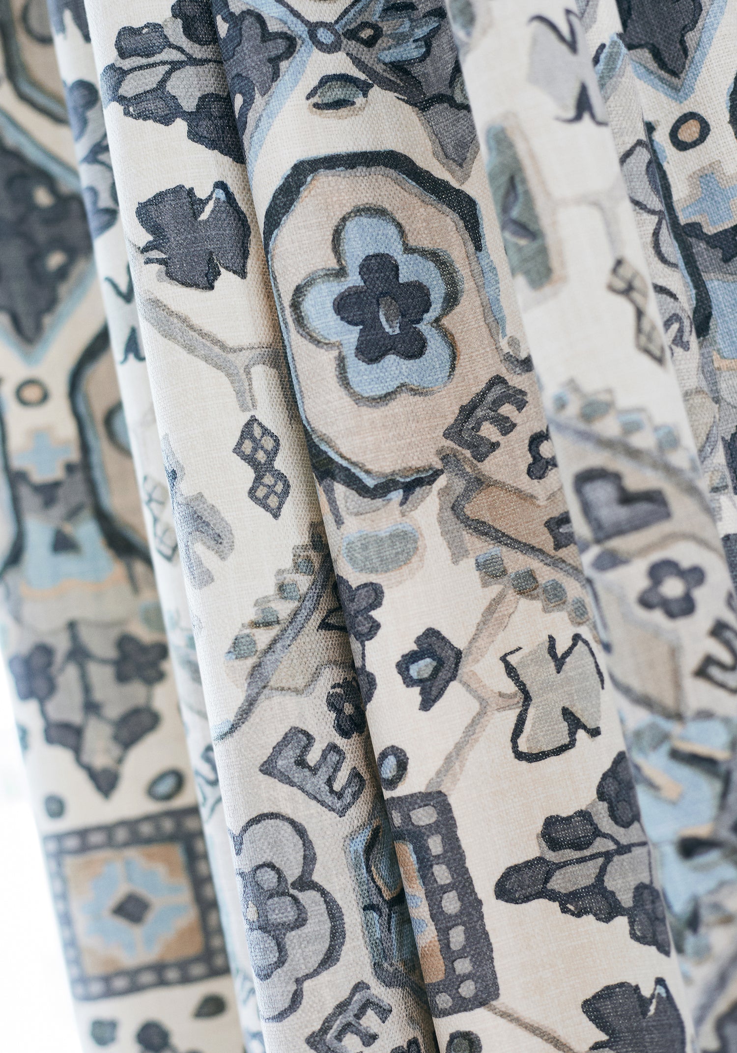 Detailed view of Persian Carpet printed fabric in grey and beige color variant by Thibaut in the Heritage collection - pattern number F910828