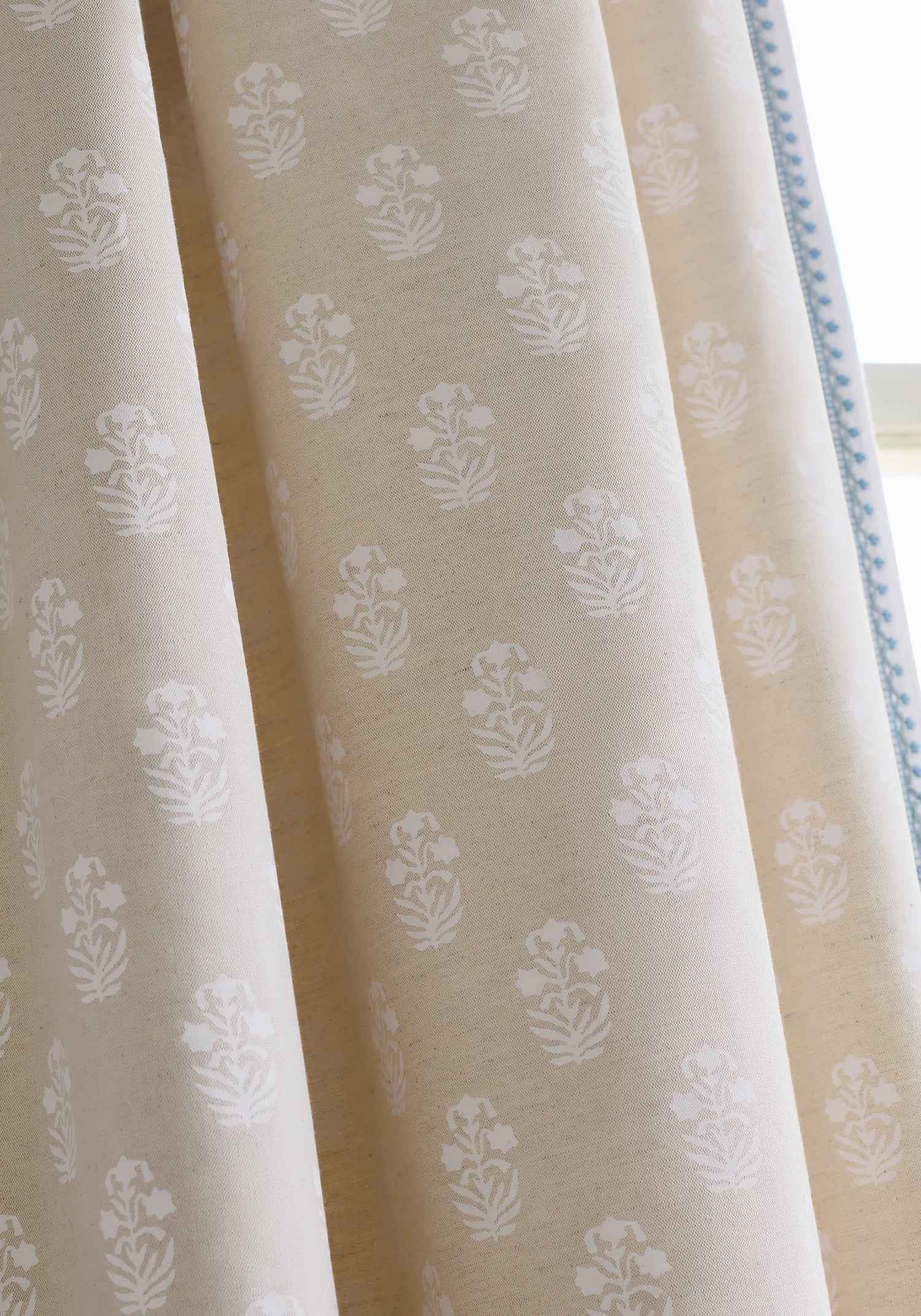 Close view of curtains featuring Corwin fabric in white on natural color - pattern number F936405 - by Thibaut in the Indienne collection