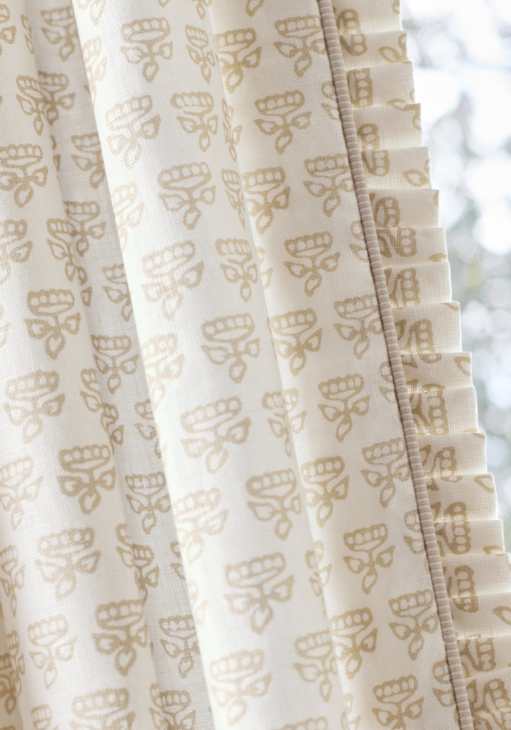 Close view of draperies featuring Mimi fabric in beige color - pattern number F936446 - by Thibaut in the Indienne collection